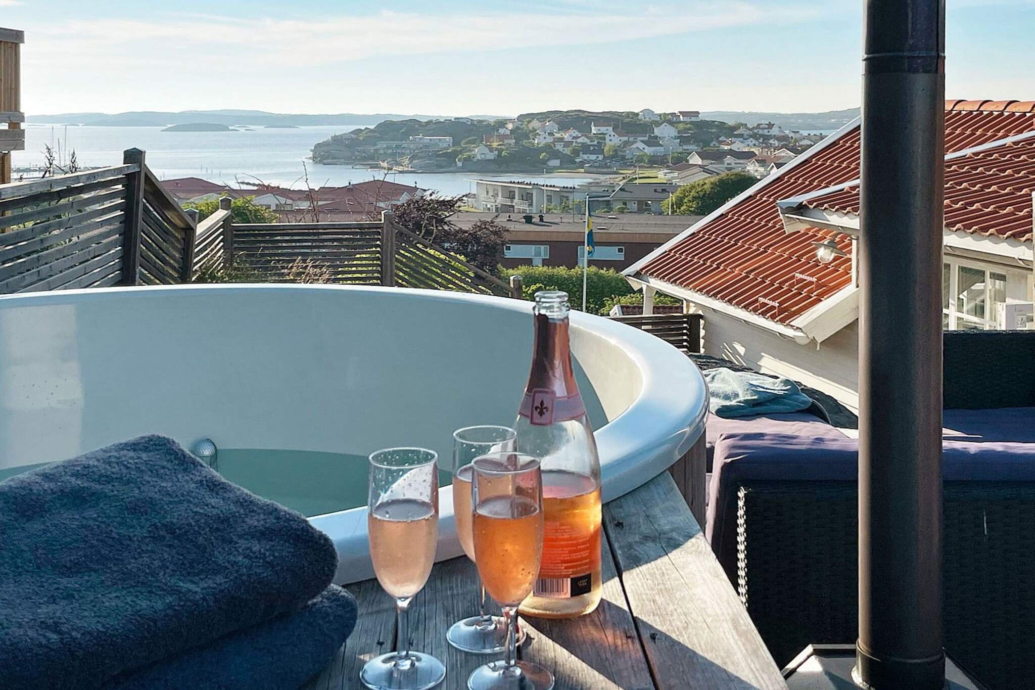 This lovely holiday home is situated in the archipelago of the west coast, in EllÃ¶s, on the beautiful island of Orust. The two-storey house is well-equipped and has a delightful view of the sea. It's just a couple of minutes' walk to the child-friendly beach. The entrance floor features a modern kitchen with all of the amenities you could need, including a dishwasher. The living room is light and airy, and features a sofa suite and a cosy wood-burning stove where you can light candles (no fire allowed). It opens onto the lovely conservatory with it's beautiful view of the sea. Next to the conservatory, you will find a furnished terrace. ATTENTION!! It is not allowed to grill on this balcony, if you want to grill, do this on the front of the house. The house has two bathrooms, both located on the bottom floor. Both of the bathrooms have a WC, a washbasin, and a shower. One of them is also equipped with a washing machine and a tumble dryer. You will find the sauna in the annex. On the second floor, you will find two cosy bedrooms and a family room with a sofa bed and a beautiful view of the sea. Each bedroom is equipped with a comfortable double bed and the family room opens onto a terrace with a  wood-fuelled bath barrel. The holiday home has a guest house with a bunk bed (the upper bunk is 80 cm wide and the lower bunk is 120 cm wide). Next to the guest house, you will find the sauna, with room for 5-6 people at a time. The lovely public beach is only 400 metres from the house, featuring a sandy beach, a bathing dock, a trampoline, cliffs, a play ground, and beach volley possibilities. EllÃ¶s offers all sorts of services, shops, restaurants and entertainment. Orust offers a variety of activities, such as kayak paddling, diving, fishing, crab fishing and golfing. There are many charming little seaside towns within driving distance, and you mustn't miss visiting the beautiful islands Gullholmen and KÃ¤ringÃ¶n. In the middle of Orust you will find the shopper's paradise, GÃ¶ksÃ¤ter, well worth a visit! The city of GÃ¶teborg is only 75 kilometres away. Due to the steep location, the house is not suitable for small children. The house is not rented out to youth groups according to Â§ 3.3 of the Rental Terms. Some changes may occur in furniture and furnishings. Welcome to this delightful holiday home!   Good to know  Check-in: 16:00 Check-out: 10:00 Earlier check-in/later check-out is not possible.