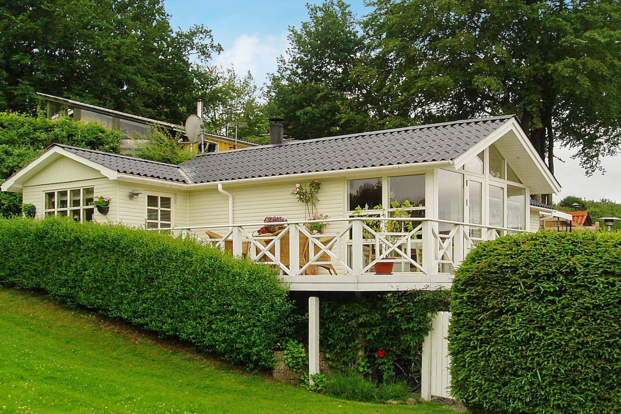 open kitchen(cooker(electric), coffee machine, microwave, fridge-freezer), Living/bed room(single folding bed, TV, DVD player, radio, chromecast), bedroom(double bed), bathroom(floor heating)(bathtub or shower, washbasin, toilet), mezzanine(single folding bed), heating(electric), terrace, air to air heatpump