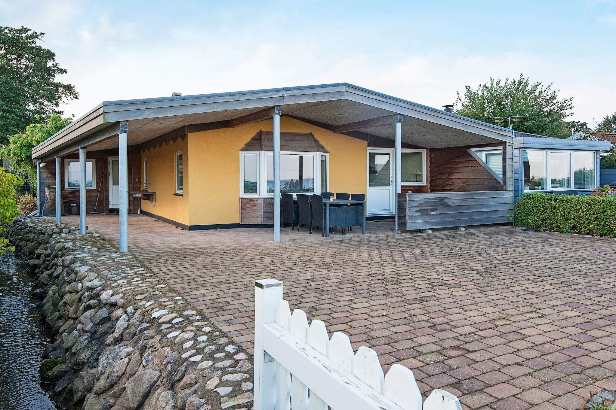 A holiday cottage on 1st row towards the sea with a panoramic view of the water and a family-friendly beach. On the covered terrace you can relax undisturbed while you enjoy the murmur of the brook that runs through the plot.A refundable deposit might be charged closer to your check-in date. The security deposit ensures a smooth stay and covers any additional services or consumption charges.This deposit covers utilities consumed during your stay and any additional services that may be taken.The final amount will be adjusted based on actual meter readings, actual usage of extra services, and any remaining balance will be refunded within 21 days after checkout.This deposit simply acts as a prepayment for charges that  you would anyways pay for, ensuring a seamless stay and check-out experience.