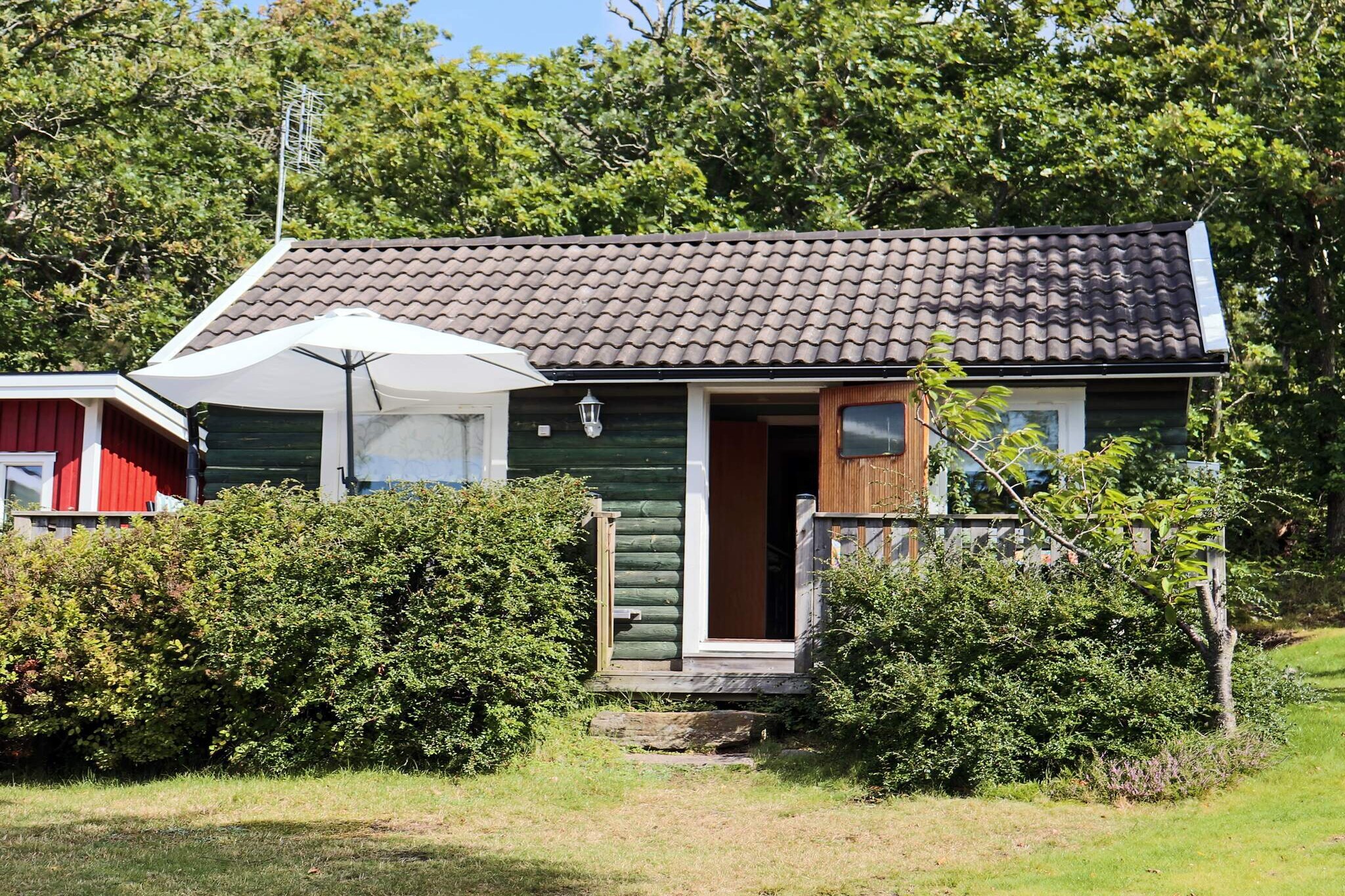 This charming holiday home is set in beautiful surroundings, in a quiet residential area. It has a beautiful view of the sea and is within walking distance of the child-friendly beach! The holiday home has a small kitchen with the basic equipment. The master bedroom features a double bed. There's also a smaller bedroom by the kitchen, it features a bunk bed. In the bathroom, you will find a WC, a washbasin, and a shower. The living room is equipped with a TV and a sofa bed. Please note that the house is for a maximum of four people. The spacious, wooden terrace has garden furniture and a grill. Ugglarp is surrounded by scenic nature, beautiful beech woods, fields, and bicycle paths. Ugglarp offers a shop, a restaurant, a bathing area and a camping area. SuseÃ¥ and Kattegatt  have excellent fishing opportunities. Don't forget to get a permit for fishing in SuseÃ¥! Visit one of the nearby golf clubs with their lovely gold courses, the closest one is in Falkenberg. Don't forget to visit the lovely village of SlÃ¶inge with it's famous ice cream factory and shop. In SlÃ¶inge you will also find a bakery, and Ã„ppelgÃ¥rden, where they serve home made cider. LÃ¥ngasand has a beautiful nature reserve, and Heberg has Laxbutiken, a popular restaurant and deli shop that specialises in Salmon. Falkenberg offers plenty of beautiful walking paths and excellent fishing opportunities. There are also tennis- and riding possibilities. The popular beach Skrea strand is just a few minutes from Falkenberg, by car, you can also take a bus or walk there. Stroll through the charming Old Town and admire the picturesque view, stop for a coffee in one of Falkenberg's excellent cafÃ©s, such as StÃ¥hlbom's or BorgmÃ¤stargÃ¥rden. Take a walk along the River Ã„tran and admire the stunning view. Falkenberg offers shops, restaurants, bars, music events and many other activities. Another nice place to visit is TylÃ¶sand, one of Sweden's most famous and popular beaches, situated close to Halmstad. Welcome to Ugglarp!