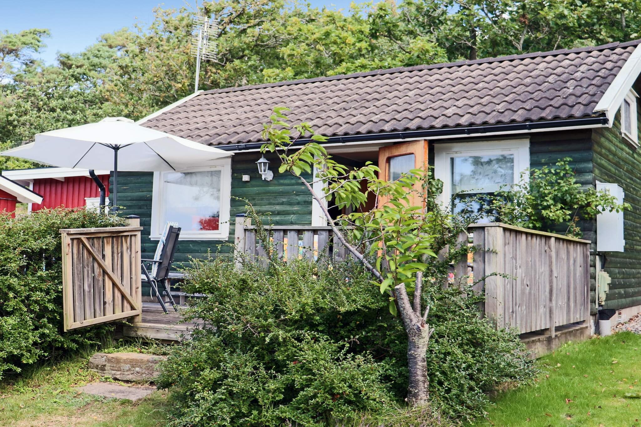 pantry(cooker(2 ring stoves), hood, coffee machine, microwave, fridge-freezer), Living/bed room(TV, radio), bedroom(double bed), bedroom(2x bunk bed), bathroom(washbasin, shower, toilet), heating(electric), terrace, garden furniture, BBQ