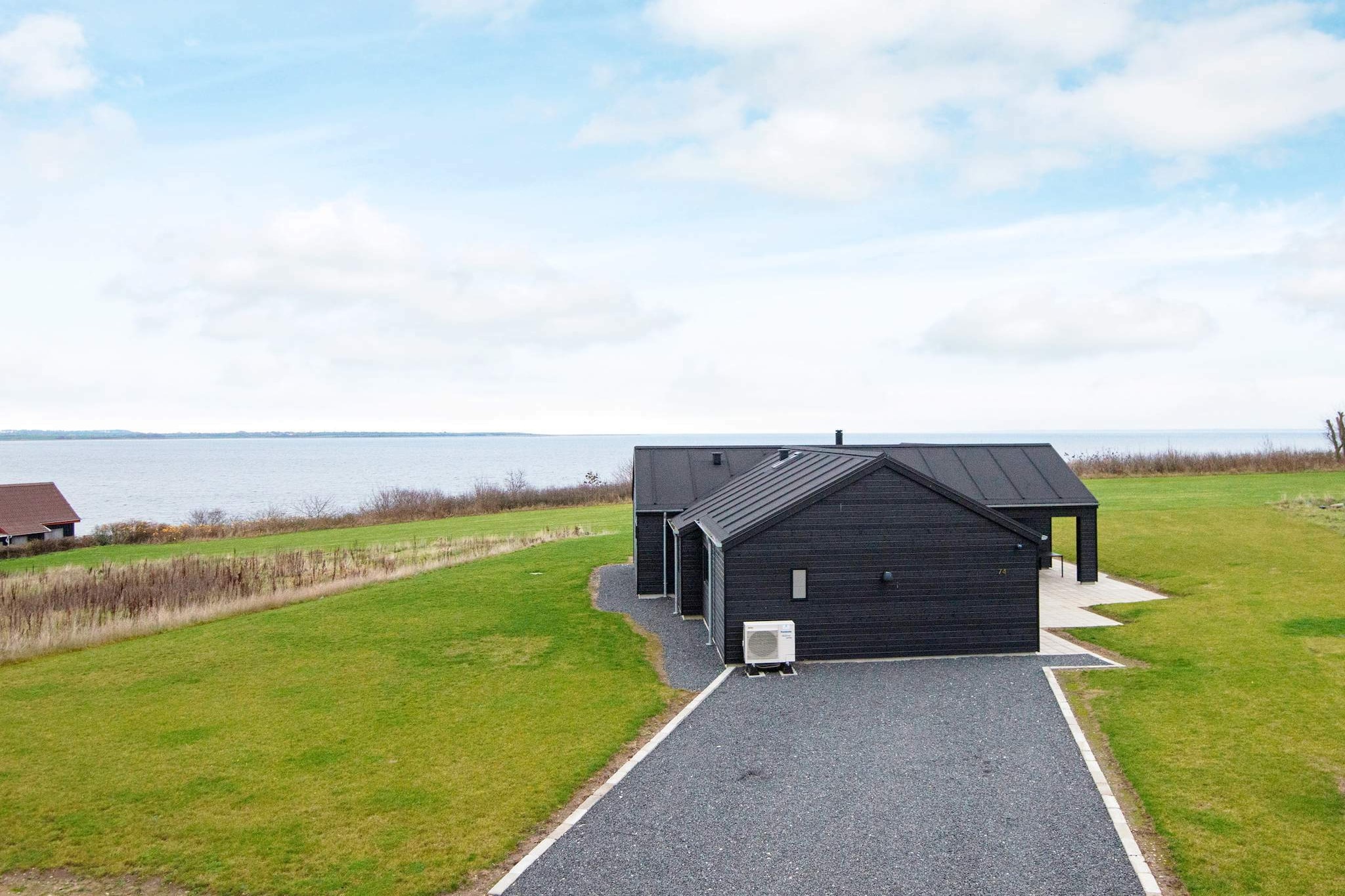 This holiday cottage can be found only 30 metres from the sea. Enjoy the panoramic view of the sea from the house. Whirlpool in one of the bathrooms. Combined living and dining room with an integrated kitchen. The house is built with high-quality materials, is well insulated and tastefully decorated. The house is heated with an energy friendly heat pump. No letting to youth groups.A refundable deposit might be charged closer to your check-in date. The security deposit ensures a smooth stay and covers any additional services or consumption charges.This deposit covers utilities consumed during your stay and any additional services that may be taken.The final amount will be adjusted based on actual meter readings, actual usage of extra services, and any remaining balance will be refunded within 21 days after checkout.This deposit simply acts as a prepayment for charges that  you would anyways pay for, ensuring a seamless stay and check-out experience.