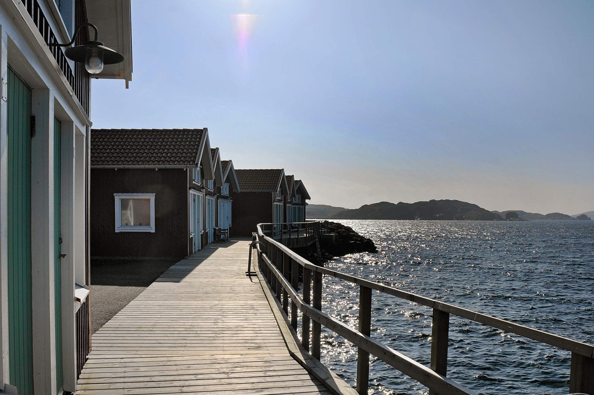 This attractive holiday home is located in the archipelago, in the town of SkÃ¤rhamn, on the island of TjÃ¶rn. The house boasts an amazing panoramic view of the sea, a private anglerâ€™s house, and a private dock right next to the house. This comfortable house offers the perfect location suitable for holidays any time of the year! The two-storey house features a beautiful kitchen, and a spacious living room/ dining room. The living room leads to the comfortable, roofed terrace.The bottom floor also contains a bathroom (WC and shower) and a laundry room. On the upper floor you will find the family room with itâ€™s TV-area and 30 TV-channels (Swedish channels as well as English-speaking channels). The family room has a sofa bed that sleeps two. The bedroom is spacious and contains one double bed. The upper floor bathroom contains a shower and a small whirlpool that fits one adult or two children. On the upper floor there is also a lovely balcony with a panoramic view. Please note that it is not allowed to charge electric cars. The lovely anglerâ€™s house is well-furnished and a ladder leading to a spacious loft with a double bed (legless). The closest beach is only 400 metres from the house. There is a sandy beach, rocks and a bathing dock. There are also crab fishing possibilities. SkÃ¤rhamn offers culture and entertainment. Visit Nordiska Akvarellmuseet, a museum of contemporary aquarelle art. Or visit the restaurants, boutiques and shops in the town! Welcome to this wonderful holiday home!
