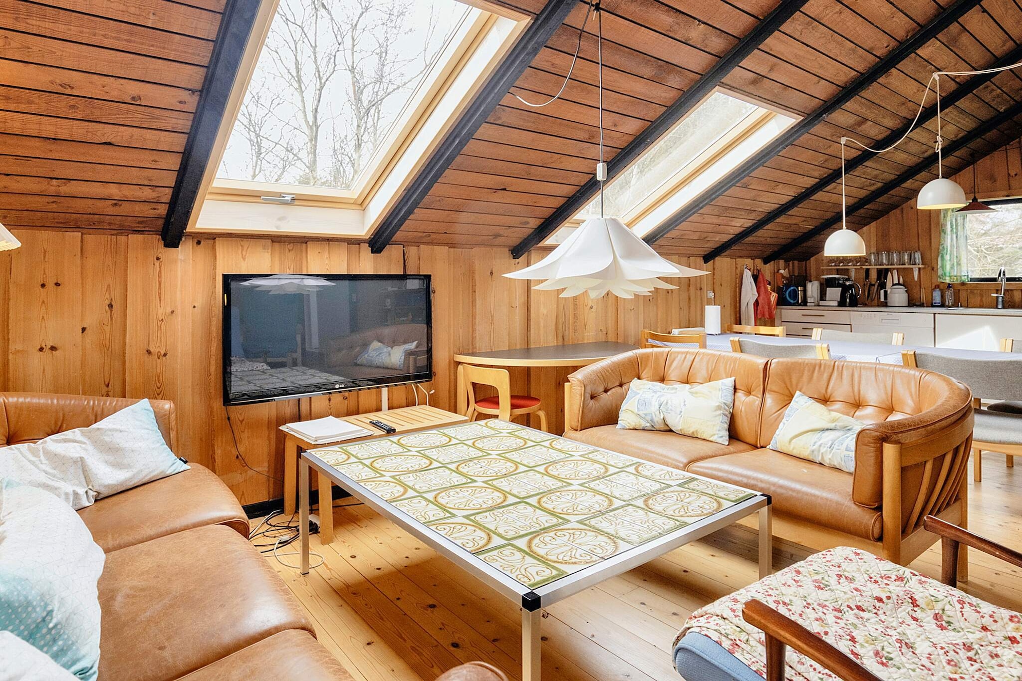 open kitchen(cooker(electric), coffee machine, microwave, dishwasher, freezer(1-59L), fridge-freezer, washing machine), pantry, Living/bed room(2x single folding bed, TV(satellite), DVD player, radio, high chair), bedroom(single bed, children\'s bed), bedroom(single bed, 2x bunk bed), bedroom(double bed), bathroom(bathtub or shower, washbasin, toilet), bathroom(washbasin, shower, toilet), heating(electric), terrace, BBQ, play equipment, football goal, air to air heatpump