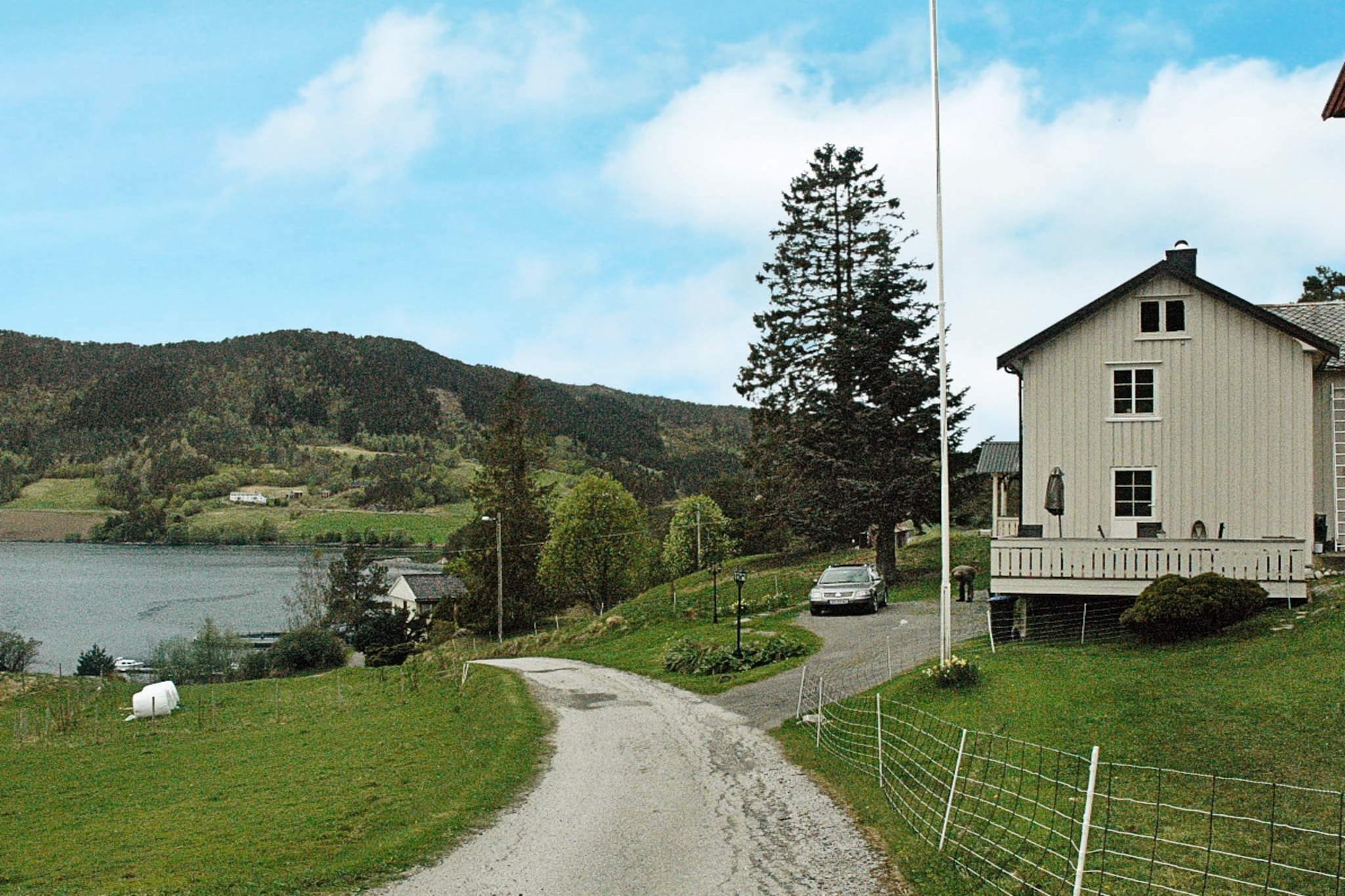 A holiday home in a semi detached house on a farm with sheep. The owner and her family lives in the other half of the house. There is a 15 m² open and sheltered terrace on the side. The home was partly renovated in 2014. The plot is 1000 m² in addition to the farmland. The double bed can be split into single beds. 3 km to a hiking trail that leads up the mountains with stunning views. The wood-fuelled bath barrel is located 100 metres from the home. Also a "barbecue hut" is at your disposal here. Several boats are available for rent.  The boats can be found in a harbour 100 metres away. Excellent fishing conditions. Life jackets and a fish cleaning table with running water and lights are at your disposal. Fishing lakes nearby. Visit the many sights and charming towns of the area.