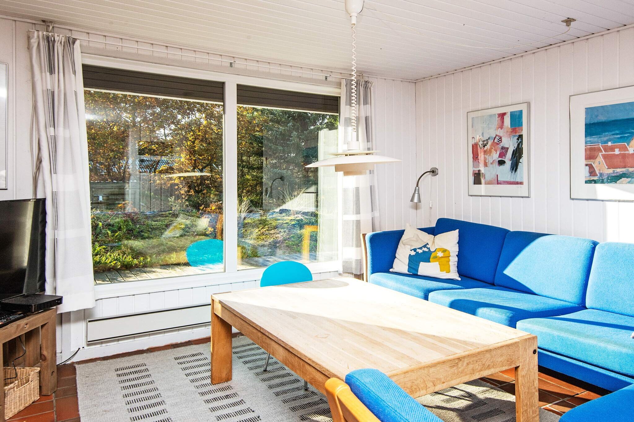 Charming Holiday Home Near Fjellerup Beach This inviting holiday home is just 4 minutes from one of Djursland's best beaches, making it the perfect getaway for anyone looking to enjoy the Danish summer. The house features a well-equipped kitchen and a lovely conservatory that seamlessly connects the living room and kitchen, offering additional space and a cozy atmosphere. With bright, comfortable rooms and a large natural plot of 1400 m², it’s a great place to relax and enjoy the outdoors. Whether you’re enjoying a sunny day or taking a peaceful break, this house provides the perfect setting for a memorable holiday. Key Features:  Living Room: Cozy space with a fireplace, wood-burning stove, radio, DVD player, TV, satellite dish, and a high chair. Bedrooms: 1 double bed, 1 twin bed, 1 double bed, plus a cot for younger guests. Kitchen: Fully equipped with an electric stove, fridge-freezer, microwave, extractor hood, coffee maker, dishwasher, and a washing machine for added convenience. Bathroom: Includes WC, sink, and shower cubicle. Outdoor Area: Terrace, covered terrace, carport, and a spacious natural plot ideal for sunbathing or outdoor dining.  Explore Fjellerup Strand Fjellerup Strand in Norddjursland offers a perfect combination of nature and stunning landscapes. The area is rich in large forests, river valleys, and breathtaking coastlines. It’s an ideal destination for outdoor enthusiasts, with opportunities for cycling, hiking, and running. The wide sandy beaches along the Kattegat, large dunes, and high chalk cliffs are perfect for exploring and fossil hunting. Whether you’re crossing the picturesque Randers Fjord by ferry or simply relaxing on the beach, Fjellerup Strand promises a refreshing and peaceful holiday experience.A refundable deposit might be charged closer to your check-in date. The security deposit ensures a smooth stay and covers any additional services or consumption charges.This deposit covers utilities consumed during your stay and any additional services that may be taken.The final amount will be adjusted based on actual meter readings, actual usage of extra services, and any remaining balance will be refunded within 21 days after checkout.This deposit simply acts as a prepayment for charges that  you would anyways pay for, ensuring a seamless stay and check-out experience.