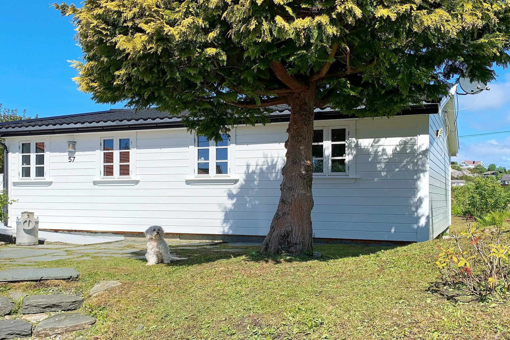 This is the perfect holiday cottage for fishing enthusiasts with a dream boat (540 CC/fisher for rent) and a lovely location by the fjord in Austrheim municipality. You have everything you need, whether you want to go fishing, hiking, experience the fjord, sightseeing or shopping in Bergen. The ocean is only 50 meters from the cottage. It is not in sight from the house, but 25 meters from the house you have a panoramic view of the fjord, islands and beaches. The house is for 4 adults and 2 children. The house has two similar bedrooms, with double beds and single beds. Enter the one with a single bed and the double bed is in the next room. There is no door in between but an opening between the single bed and the double bed. The house is relatively new, modern and has a practical set-up. The boat for rent has a livewell and an open abaft wall, and the swimming platform makes it easy to board the boat. The boat has a double hull that makes sure it stays afloat no matter what. You have access to a large boathouse of 60m³ built in 2016, where you can store fishing equipment and where the fish cleaning table and freezer (200 - 249 litre) is located.  You can rent two kayaks including life jackets, and with these, nature is very accessible. Only experienced kayakers. You can suntan, go swimming and barbecue just 50 meters from the house. There are several signed hiking trails nearby and you can visit the Rhododendron park with approx 2000 trees and bushes - a great spectacle in spring. Bergen with all its sights and attractions, is only an hour drive away.