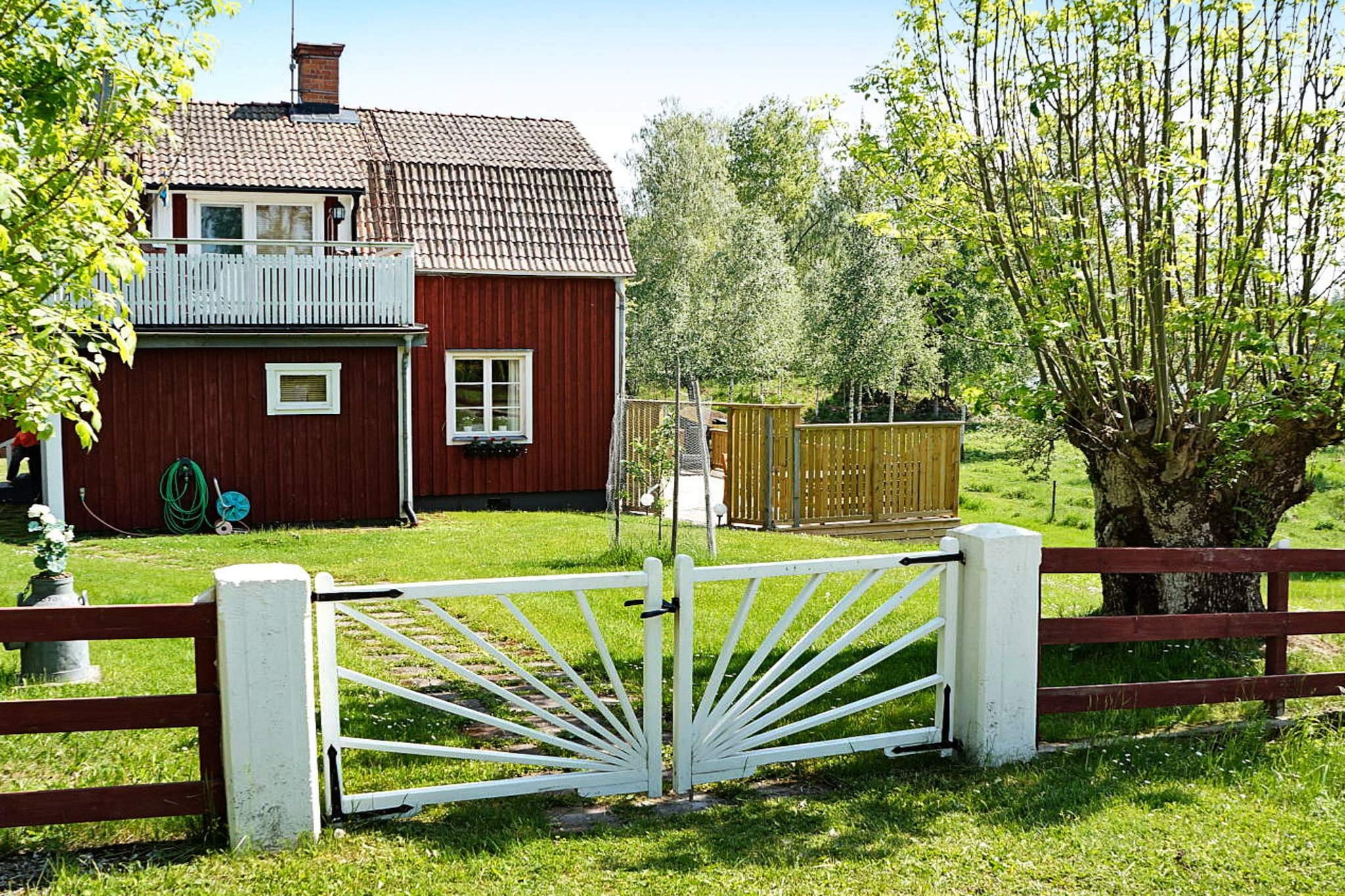 This delightful holiday home is set in idyllic surroundings outside of the little town of Ã…tvidaberg. It is a traditional Swedish country cottage, renovated but with the original charm kept intact. It features a large, 40 square metre terrace and a delightful balcony with a white picket fence. The view is terrific , this is the perfect place to relax and enjoy life!  The bottom floor features a kitchen with brand new appliances and a pleasant dining area. In the family room you will find a comfortable sofa suite and a flat-screen TV. There is WiFi in the house, up to 10 gb per week.The attractive, newly-renovated bathroom ( including a washing machine)  is also located on the bottom floor.  A winding staircase takes you up to the second floor hall and two bedrooms with a single bed in each. The garden offers plenty of lawn space and borders on the forest, open landscapes and pastures, with wild animals, birds and deer.  A short walk of 75 metres will take you to your private dock and the boat that is included in the rent. The area offers a beautiful countryside, with a forest, lakes, walking paths and wild animals. The charming town of Ã…tvidaberg is close. You will be about an hour's drive from TÃ¥kern, one of Sweden's most famous bird-watching lakes. Or why not take a day trip to LinkÃ¶ping and NorrkÃ¶ping ( 25-45 kilometres) and go shopping or sightseeing. Other places to see are KolmÃ¥rden's Wildlife Reserve and Astrid Lindgren's World in Vimmerby, both about 1,5 hours away by car.  Please note: No dogs allowed!  Welcome to this charming holiday home!