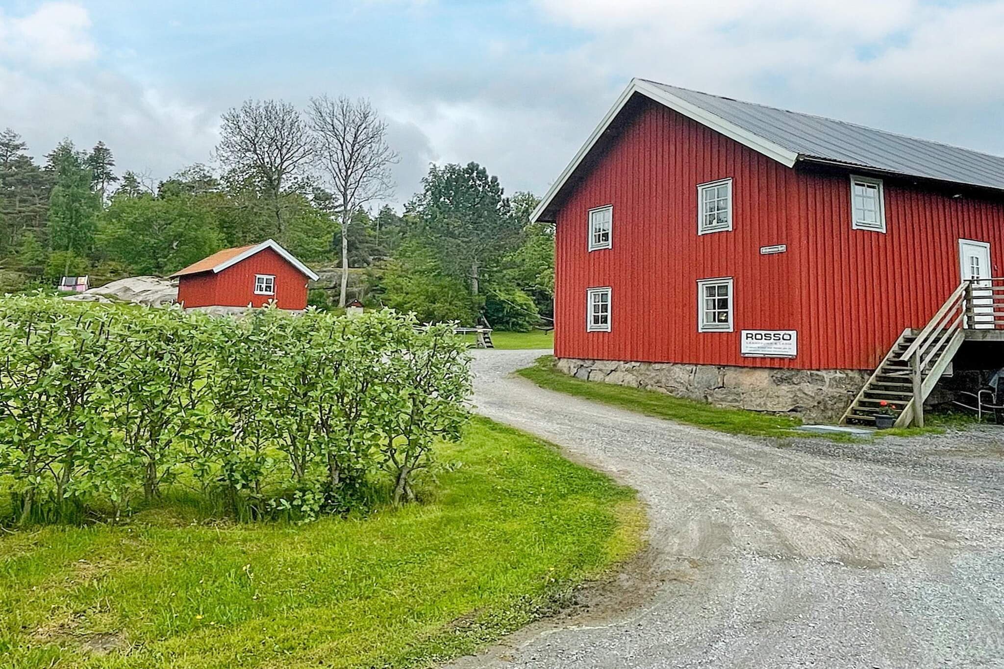 Lovely and rustic home in a former stable, with partial sea views and a peaceful location on the beautiful RossÃ¶ peninsula on Orust. Perfect for a family who wants to live in a rural environment with proximity to saltwater swimming and walking areas. The stable building is located on a former farm dating back to the 19th century, adjacent to both a nature reserve and bird watching sites. The home was completely renovated tastefully and personally in 2013, where old beams, wood, bricks, etc. were used. At the entrance you have a balcony with lovely evening sun where you have a view of the area and the KalvÃ¶fjord. On the entrance floor is a hall and a bathroom with a shower cabin where the owner has decorated the ceiling with his old vinyl records. Half a flight of stairs down (low ceiling at the stairs) is the bar kitchen and bedroom in what was the former stable. Here much of the stable feel remains with stable stalls and untreated poured concrete floors in fine harmony with the personal interior details. The bar kitchen has a mini oven with two hotplates. Bright bedroom with open stable entrance (no door) and three single beds that function as sofas with pillows during the day. A perfect bedroom/living room for children and young people who want to live a little to themselves. Upstairs is the spacious, bright living room with high ceilings and exposed beams. There is plenty of room for the whole family in both the sofa area and around the dining table. In a cozy alcove screened off with a curtain there is a comfortable double bed. You live very idyllically with grazing cows and sheep in the pastures and walking distance to RossÃ¶'s beautiful swimming area with cliffs, jetty, swimming stairs and diving tower. Take the opportunity to hike in the nature reserve on RossÃ¶. Here there are nice walking areas consisting of oak groves and pastures. The adjacent bay is a popular birdwatching spot with good chances of seeing both eagles and wading birds. There is also excellent fishing water for mackerel and trout, among others. Experience the archipelago and fishing villages around Orust. Take the ferry to the picturesque islands of KÃ¤ringÃ¶n and Gullholmen. If you are interested in shopping, don't miss a visit to GÃ¶ksÃ¤ter with the bargain department store Arvid Eriksson, just a few minutes away by car. Summer on Orust offers many activities - festivals, kayaking, diving, fishing, playing golf or just enjoying the peace and quiet and the beautiful nature. The owner has a garage in part of the stable building that is accessed from the farm side. The residential part has no view from the other buildings on the farm. A small road with very little traffic passes in front of the house. Welcome to an original and exciting home with a great location on beautiful RossÃ¶!