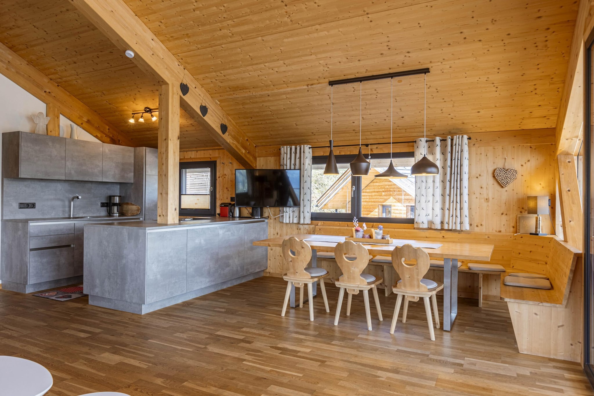 "Welcome to our elegant Superior Chalet, where modern luxury meets alpine charm. Spanning 120 m², this beautifully designed chalet comfortably accommodates up to 8 guests, offering a perfect retreat for families or groups.  
The chalet features four spacious bedrooms, each with its own en-suite bathroom, providing both privacy and convenience. An additional bathroom with a bathtub and a panoramic sauna ensures that you can unwind in style. Enjoy stunning vistas from the two furnished balconies, which offer breathtaking views of the iconic Dachstein mountain and the expansive Enns Valley. 
The open-plan kitchen is a culinary enthusiast's dream, equipped with a ceramic hob, oven, dishwasher, and fridge with a freezer compartment. Essential kitchenware, including cutlery, cookware, a toaster, kettle, and coffee machine, is provided. To ensure a hassle-free arrival, a small starter set with dishwasher tabs, dishwashing liquid, a sponge, garbage bags, a cleaning cloth, and a tea towel will be ready for you. 
Highlights of this chalet include its prime location directly on the ski slope, offering convenient ski-in/ski-out access in winter and direct hiking trail access in summer. The property also features free Wi-Fi and satellite TV for your entertainment and connectivity. 
Please note that all images are sample representations, as each chalet is uniquely decorated to provide a personalized and distinctive experience. 
The chalet includes the Schladming-Dachstein Summer Card (mid-May to early November), adding extra value to your stay. Book your alpine getaway today and immerse yourself in the luxury and natural beauty of this exceptional chalet! "