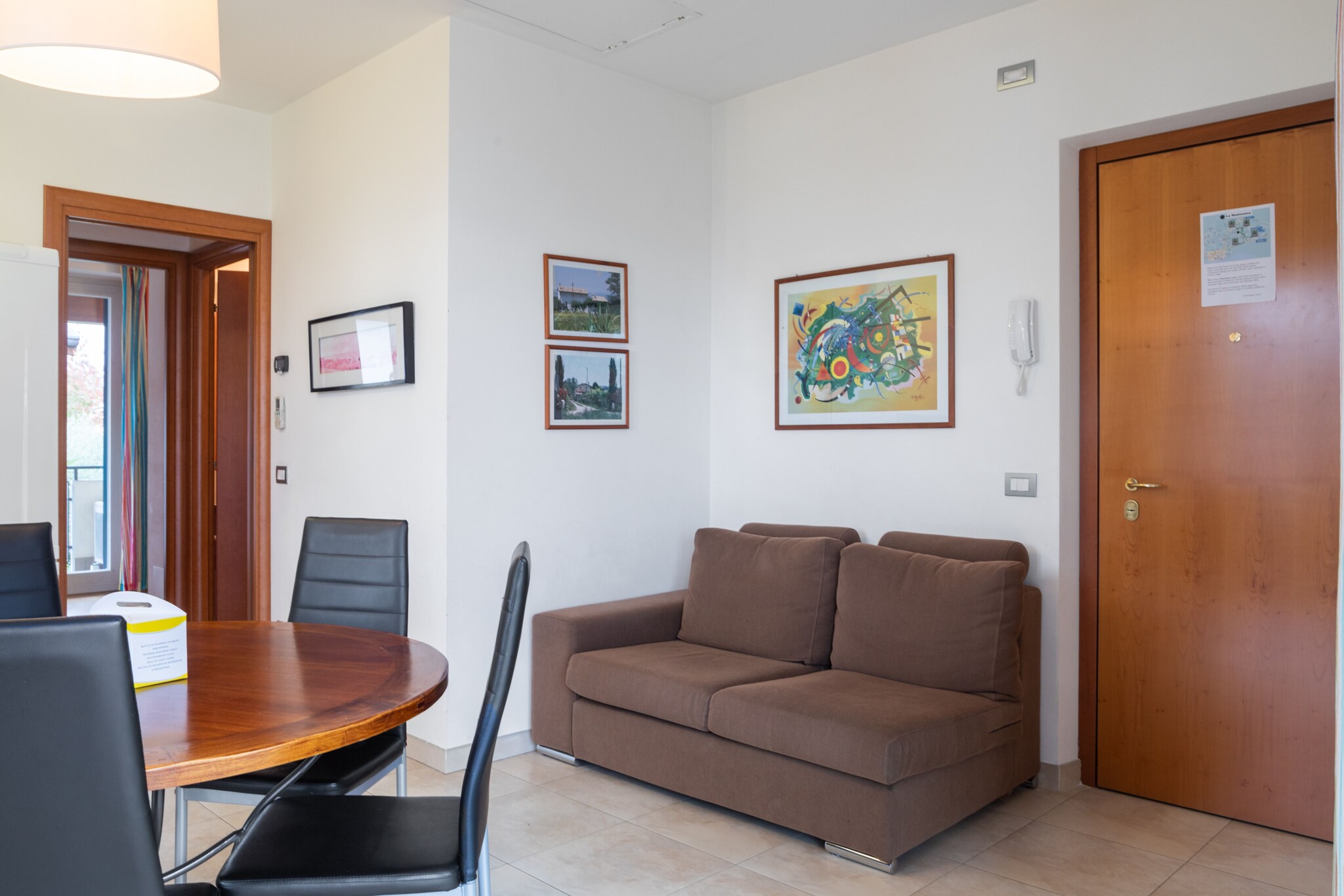 This delightful first-floor apartment at Via Trento 31 offers a warm and inviting atmosphere with an open kitchen flowing into a combined living and dining area. It features two bedrooms, one with a comfortable double bed, and a second with a single trundle and bunk bedâ€”plus a bathroom with both a shower and washbasin. Entertainment is easy with satellite TV, and practical appliances include a washing machine, dishwasher, heating, and air conditioning. Step outside onto a private balcony or enjoy freshly made meals in the shared garden.

The property boasts top-tier conveniences: central gas heating, reliable air conditioning, and free Wiâ€‘Fi. Outdoor features include a fenced shared garden with furniture, a communal 10â€¯Ã—â€¯5â€¯m swimming pool open from Mayâ€¯15 to Septâ€¯15, plus parking options with a garage and carport. These amenities make it ideal for families, allowing effortless living and relaxation.

Surrounded by the magic of Lazise, just 1â€¯km from both town centre and Lake Garda, the location is unbeatable. Explore the medieval Scaliger Castle and fortified walls or stroll the charming lakeside promenade lined with colourful buildings and boats. Food lovers can indulge at Trattoria dal Pansa and Lâ€™Osteria Marengo, enjoy seafood at Il Porticciolo by the water, or sample local fare at Cozzeria Alle Mura in the bustling centre. Enjoy lakeside dinners, vibrant Wednesday markets, and unforgettable sunsets, this apartment truly captures the essence of Lazise life.