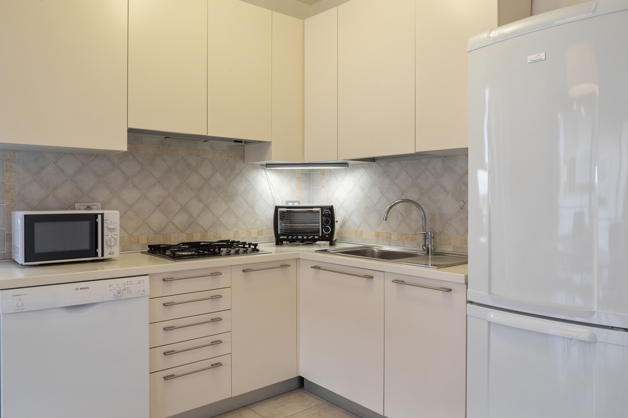 On the 1st floor: (open kitchen, Living/diningroom, bedroom(double bed), bedroom(single trundle bed, bunk bed), bathroom(shower, washbasin, toilet), TV(satellite), washing machine, balcony, heating(central, gas), air conditioning)\n\ncarport, garden(shared with other guests, fenced), garden furniture, swimming pool(shared with other guests, 10 x  5 m., opened from 1/2 May upto and including 1/2 Sep)