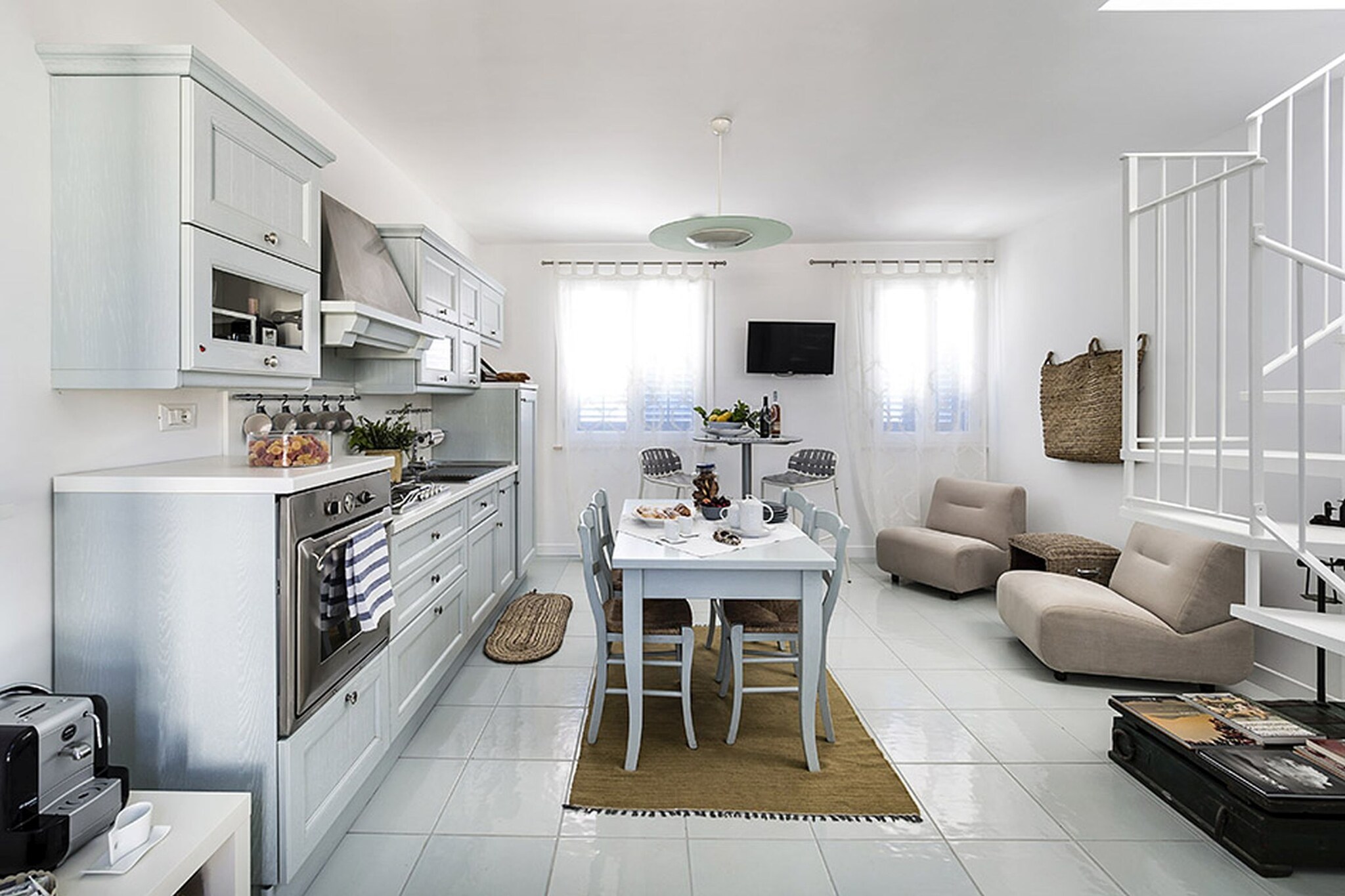 Ground floor: (shower(shared with other guests, outside), patio, parking)\n\nOn the 1st floor: (open kitchen(cooker(4 ring stoves, gas), oven, dishwasher, fridge-freezer), Living/diningroom(TV, DVD player, CD player, high chair), bedroom(bunk bed), bedroom(double bed or 2 single beds), bathroom(shower, washbasin, toilet, bidet, washing machine), bathroom(shower, washbasin, toilet, bidet), balcony, heating, air conditioning)\n\nOn the 2nd floor: (roof terrace)