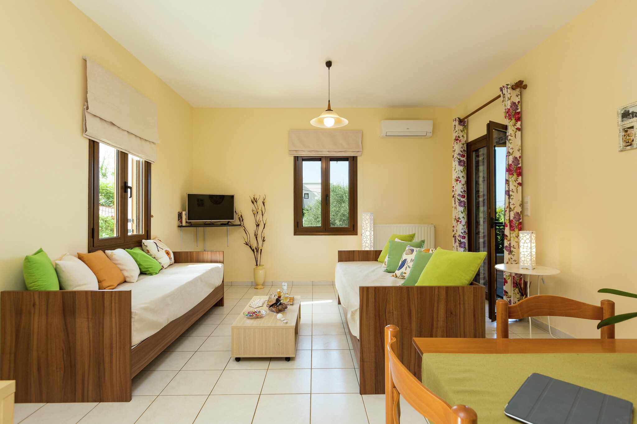 Located at the entrance of the peaceful village of Prines, just 5 km from Rethymno, this charming apartment complex offers a relaxing stay surrounded by nature. Set within a 4000 m² fenced garden with olive trees, vibrant flowers, a grill, BBQ area, and parking, it's perfect for families or couples seeking comfort and tranquility.
The "Romantic Apartment" is tastefully furnished in a cozy style and features 1 bedroom with a double bed, a fully equipped kitchen, and a spacious lounge with two sofa beds—ideal for up to 4 guests. Guests can enjoy breakfast or unwind on the large private veranda while soaking up the garden views and fresh Cretan air.
The sea is just 2 km away, and for lively beach days or local dining, Rethymno and nearby villages like Atsipopoulo offer shops, bakeries, tavernas, and more. This apartment is a wonderful base for exploring nearby beaches such as Petres and Georgioupoli, or simply enjoying the serene rhythm of village life.