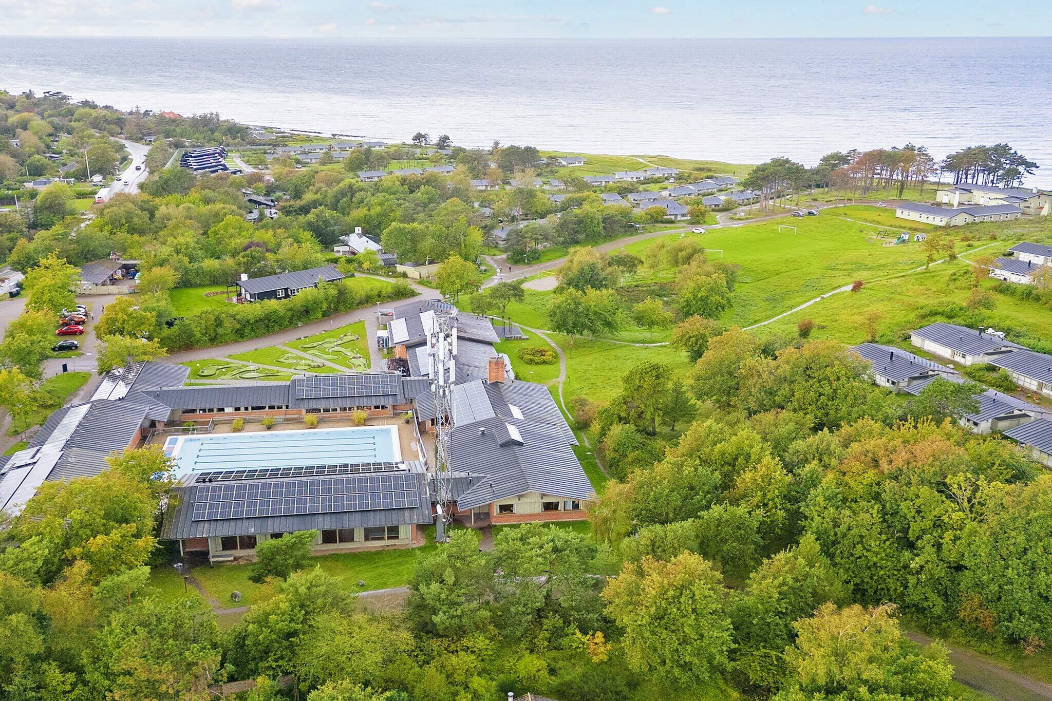 Holiday center Kysthusene in Gilleleje Directly in the open nature, so close to the Kattegat that you can hear and smell it. Pool (indoor and outdoor), sauna, free internet and playground are some of the many facilities the resort offers. Watch movies on YouTube. Experience Feriecenter Gilleleje on a virtual 3D tour Take a tour of the holiday center in Gilleleje. Here you can check out both the indoor and outdoor pool area, take a look at the restaurant, fireplace room, games room, mini golf course and enjoy the surroundings of the holiday center before checking in. In other words, you have the opportunity to go wild at the holiday center in North Zealand. All you have to do is click on the video, drag in the image and go exploring. About Feriecenter Kysthusene in Gilleleje Here you and the family live directly next to the Kattegat, where the sandy beaches and slopes invite to activities for the whole family. The cozy holiday homes are located bright and airy in the middle of the North Zealand nature, and several of them have a view of the sea. Danland Gilleleje has established a special cleaning area for anglers. In the lively trading town, Gilleleje, they have managed to preserve the majority of the old fishing village's small alleys and idyllic, thatched houses. You are not far from Copenhagen's many shopping and cultural offerings, where you, among other things. can touch the brain muscles in the Experimentarium and have an adventurous day for the whole family in Tivoli. Course facilities at Gilleleje Holiday Center Five conference and meeting rooms in different sizes from 15-180 people and two smaller group rooms for 6-12 people. Read more about Gilleleje Kursuscenter Feriecenter The coastal houses in Gilleleje are non-smoking Note - The homes are privately owned. Furniture, patio furniture, equipment and service belong to the individual homes and must therefore not be moved from the house

A refundable deposit might be charged closer to your check-in date. This deposit covers utilities consumed during your stay and any additional services that may be taken. The final amount will be adjusted based on actual meter readings, actual usage of extra services, and any remaining balance will be refunded within 21 days after checkout.