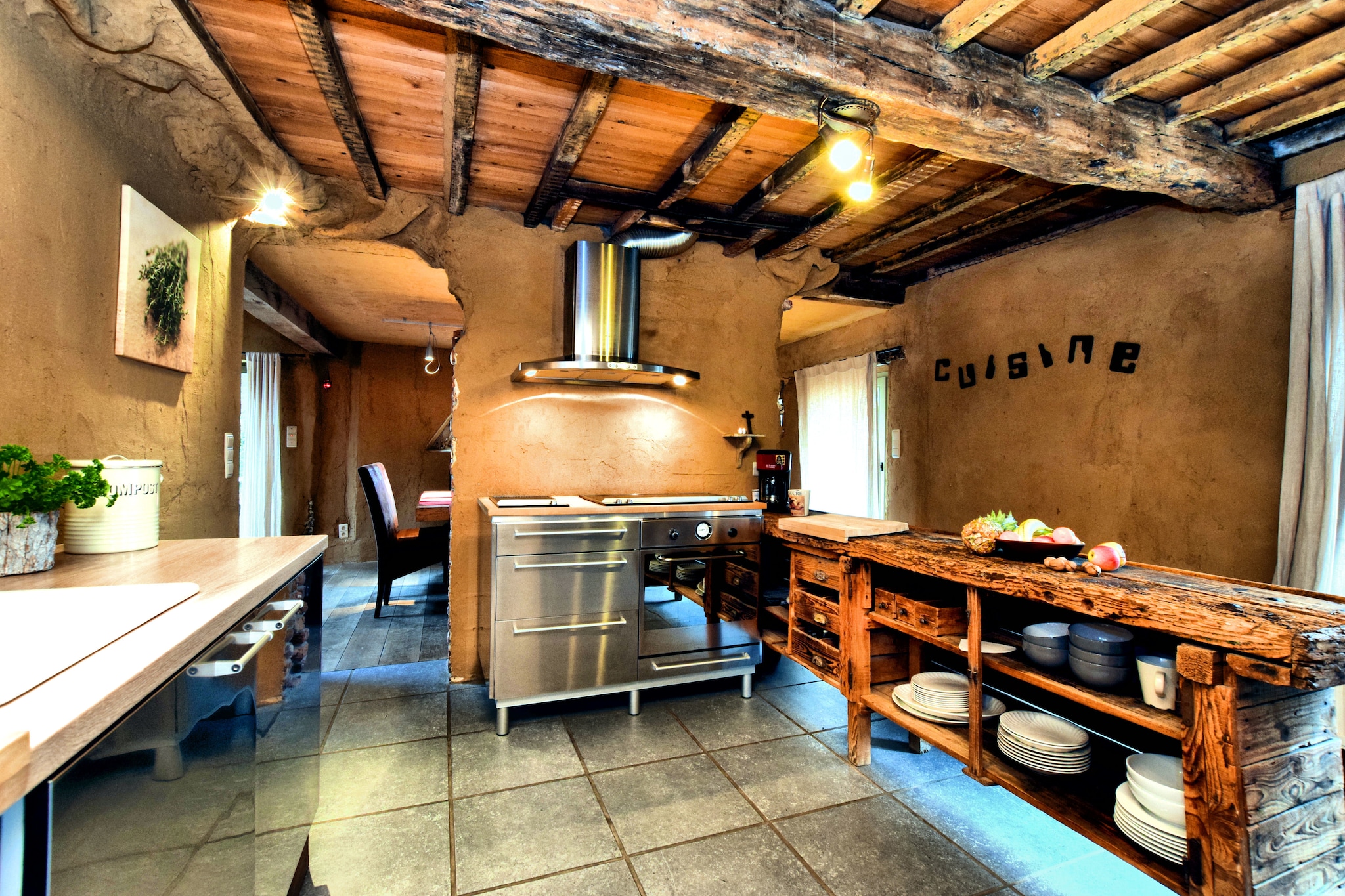 Ground floor: (Kitchen(electric kettle, toaster, cooker(4 ring stoves), hood, coffee machine, oven, microwave, dishwasher, fridge), Living/diningroom(TV(flatscreen), dining table, fireplace, seating area(5 persons), radio), toilet, recreation room(tumble dryer, washing machine, table football, darts))\n\nOn the 1st floor: (bedroom(double bed(160 x 200 cm)), bedroom(3x single bed(90 x 200 cm)), bathroom(bath tub, shower, 2x washbasin, toilet), Landing, infrared sauna)\n\nheating(central), terrace, garden(shared with other guests), garden furniture, BBQ, parking, pond, deckchairs, boules court, hammock, children\'s bed, high chair