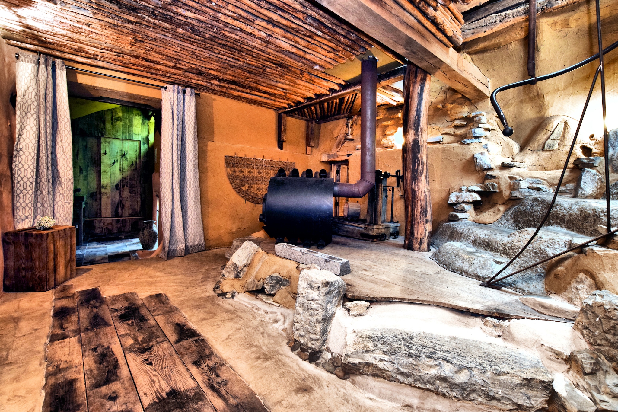 An optional utilities and service fee of EUR 69,60 will be charged before your arrival. Details are given below.<br> If you fancy spending your holiday in a unique place, then this farmhouse in Durbuy which is distinct and attractive is an apt choice. There are 3 bedrooms to house 7, making it ideal for a large family. There is a sauna facility to heal the tired souls and a terrace and garden (shared) to enjoy the outdoors._x000D_
_x000D_
There is a forest, 1 km away, where you can go for walks. The buzzing town centre of WÃ©ris, 2 km away can be visited for shopping or enjoying meals. _x000D_
_x000D_
The centrally heated farmhouse has a spacious hallway where you'll see a wood-burning stove shaped like an engine block and the space around it is carved out like a cave. This theme continues up the stairs that wind upwards like rocky steps. In the living room there's a stairway made of a tree trunk, and the whole property has been done in similar fashion, while providing all comforts. Barbecue, boules court and parking are other available facilities._x000D_
_x000D_
Barvaux train station is the nearest, 7 km away. <br><b> Optional Utilities & Service Package </b><br><b> An optional utilities and service package of EUR 69,60 </b> can be selected prior to your arrival. You will receive a separate communication with the payment link should you wish to include it.<br>This package ensures a seamless stay and conveniently covers services such as final cleaning, utility consumption, service support, and protection against minor damages or incidental costs during your stay.<br>Guests who prefer may manage these services independently, provided the property is returned in good order at check-out.