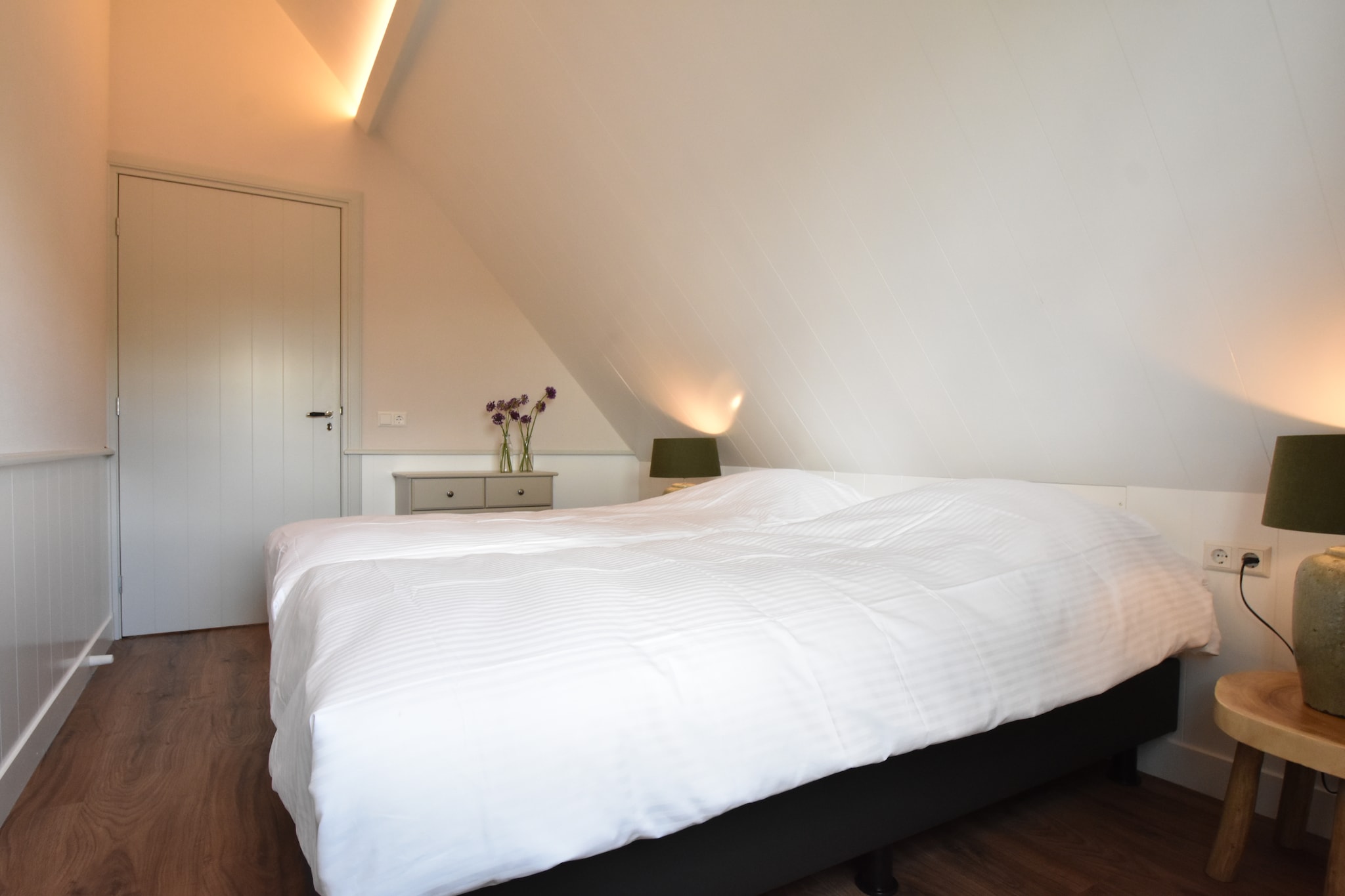 Ground floor: (Entrance, hall, open kitchen(electric kettle, cooker(4 ring stoves, gas), coffee machine(filter), oven, microwave, dishwasher, fridge, freezer), Living/diningroom(TV(digital, international television channels), dining table(24 persons), seating area, stereo unit), bathroom(3x shower, 2x washbasin, 2x toilet), bathroom(2x shower, 2x washbasin, 2x toilet), garden doors, terrace(56 m2), garden(partially fenced), garden furniture, parking, parasol)\n\nOn the 1st floor: (bedroom(2x single bed), bedroom(2x single bed), bedroom(2x single bed, 2x double loft bed, washbasin), bedroom(2x single bed, single box bed, double bed box, double loft bed, washbasin), bedroom(2x single bed, single box bed, double bed box, double loft bed, washbasin))\n\nbathtub or shower, party games