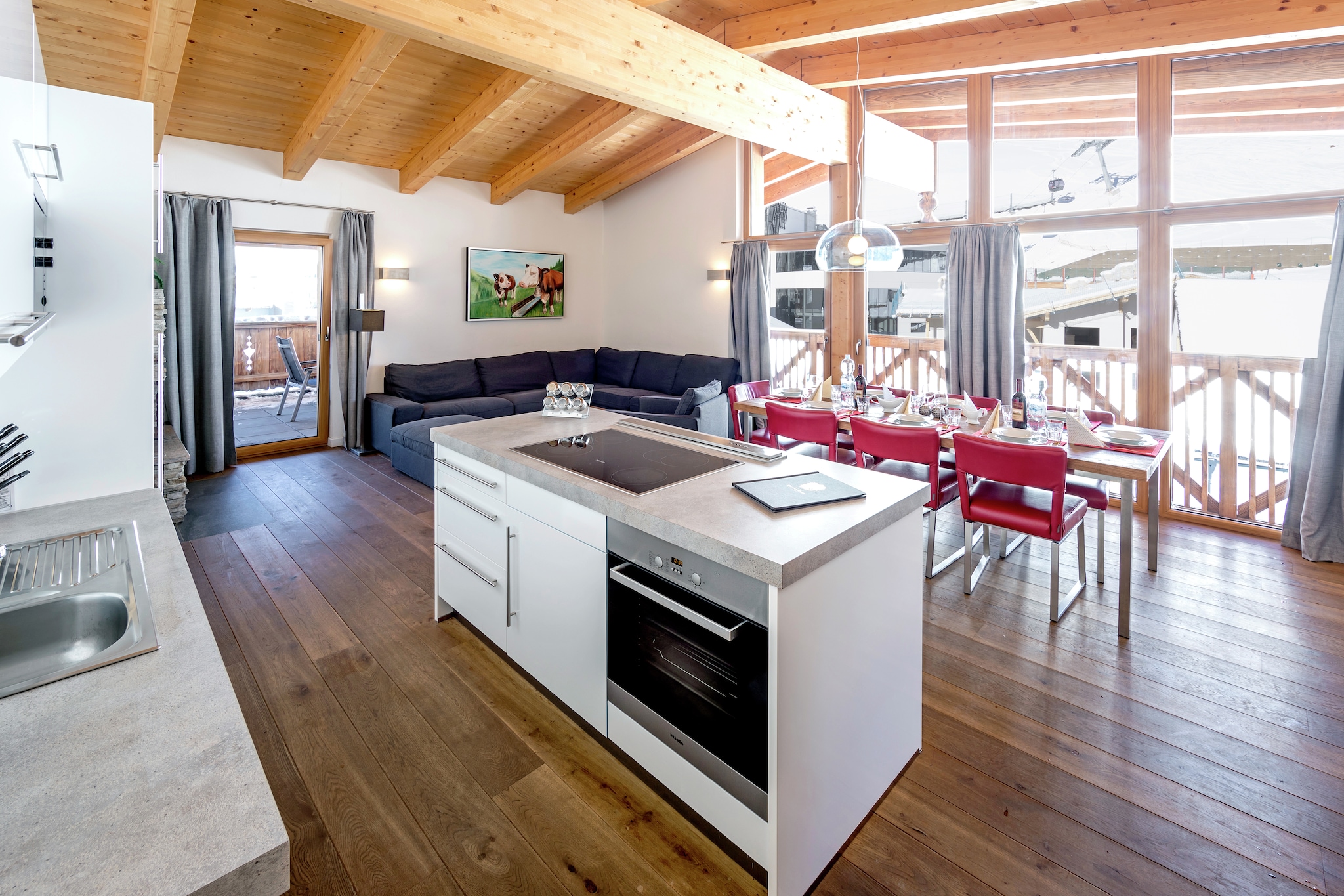 On the 3rd floor: (Living room(TV, stove(wood), seating area(8 persons)), open kitchen(cooker(ceramic), coffee machine, oven, combination microwave, dishwasher, fridge-freezer), bedroom(double bed, TV, balcony), bedroom(double bed, TV, balcony), bedroom(double bed, TV, balcony), bedroom(double bed, TV, balcony), bathroom(bath tub, shower, washbasin, toilet), bathroom(bathtub with shower, washbasin, toilet), relaxation area(shower, sauna))\n\nski storage, garage, fireplace, streamingservice, tumble dryer(shared with other guests, paid), bathtub or shower, washing machine(shared with other guests, paid), heating(floor heating), terrace, roof terrace, garden furniture, parking, lift, children\'s bed, high chair