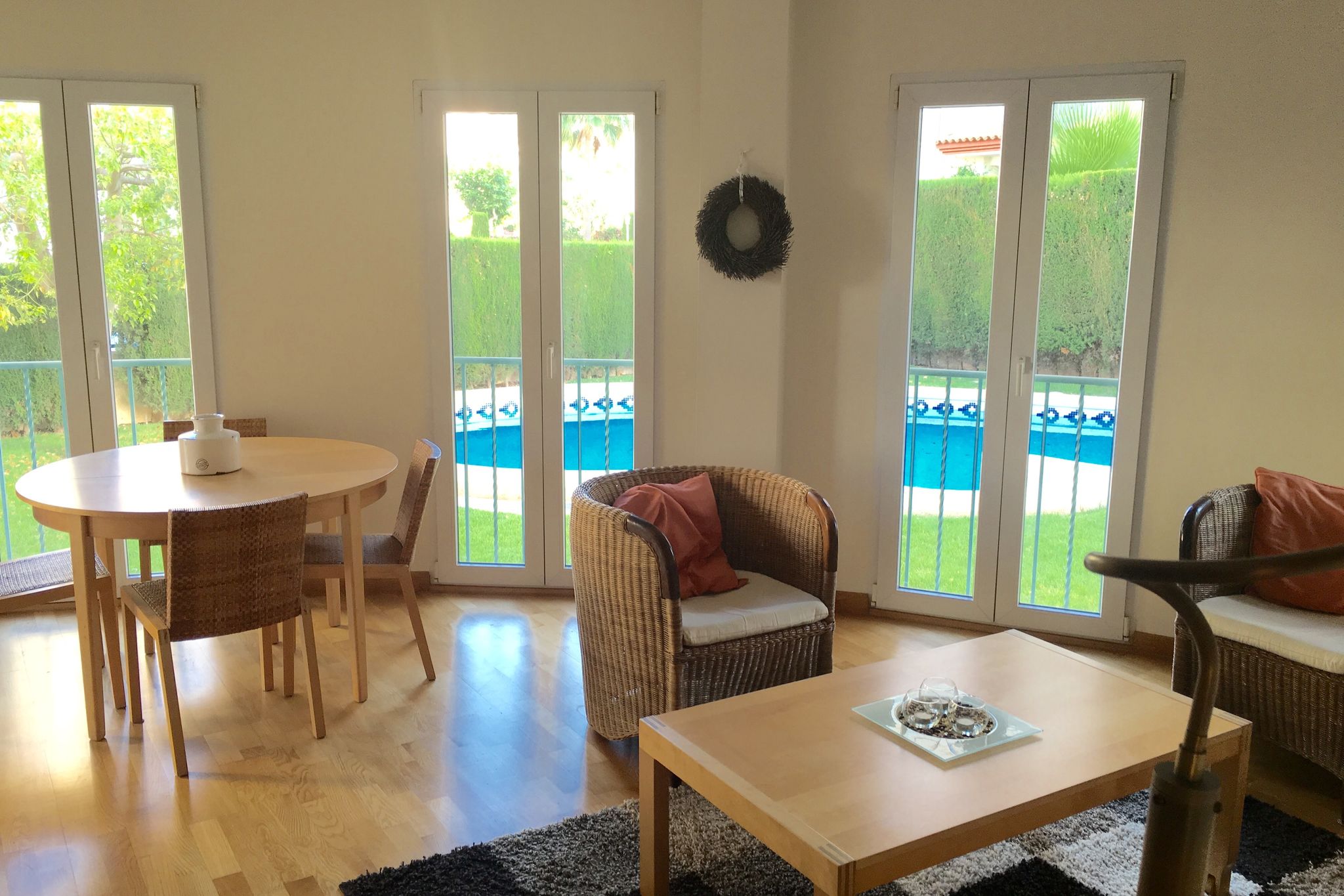 Light apartment with communal pool and walking distance to the beach