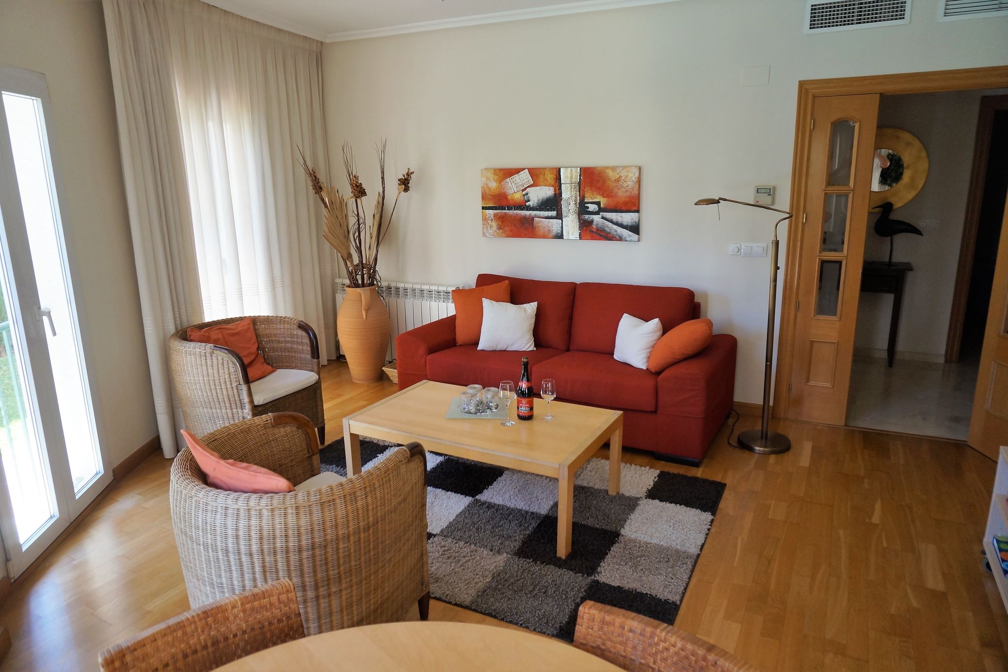 Light apartment with communal pool and walking distance to the beach