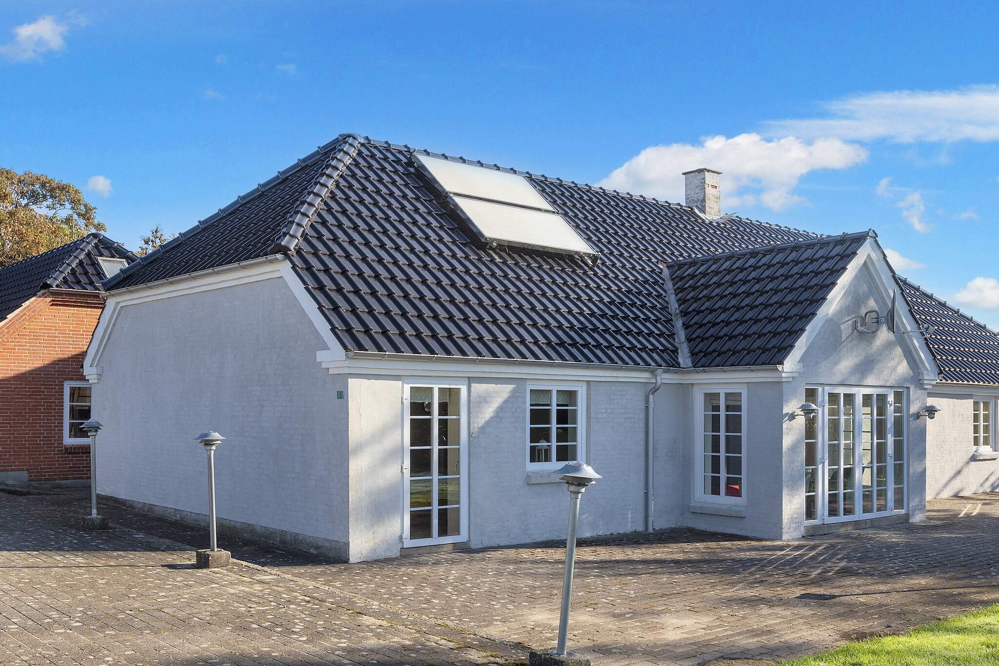 Located on the idyllic Limfjord island of Fur, this spacious and modernised holiday home offers 242 m² of comfort — ideal for families who value room to relax. Thoroughly renovated in 2017, the house features two large living rooms, each combined with a fully equipped kitchen. One kitchen includes an induction stove, microwave, and dishwasher, while the other also offers modern appliances and practical layout. Comfortable furnishings, a flat-screen TV with satellite channels, stereo with CD player, and free Wi-Fi make it perfect for both short stays and extended holidays. The house has three large bedrooms, all with direct access to the terrace, as well as a loft space and extra sleeping options in the living room. Two bathrooms with showers and underfloor heating ensure convenience for larger groups. Designed with sustainability in mind, the property includes energy-efficient air-to-water heat pumps, solar panels for hot water, and a masonry stove to support indoor heating, making it cozy and eco-friendly year-round. Set on a peaceful natural plot just 1,200 meters from the Limfjord, this home offers both tranquility and family-friendly fun. A large shared playground is only 600 meters away, perfect for the youngest guests. With generous outdoor terraces and a scenic setting, the property is an excellent base for exploring Fur’s natural beauty. Please note: the house is not rented to youth groups.A refundable deposit might be charged closer to your check-in date. The security deposit ensures a smooth stay and covers any additional services or consumption charges.This deposit covers utilities consumed during your stay and any additional services that may be taken.The final amount will be adjusted based on actual meter readings, actual usage of extra services, and any remaining balance will be refunded within 21 days after checkout.This deposit simply acts as a prepayment for charges that  you would anyways pay for, ensuring a seamless stay and check-out experience.