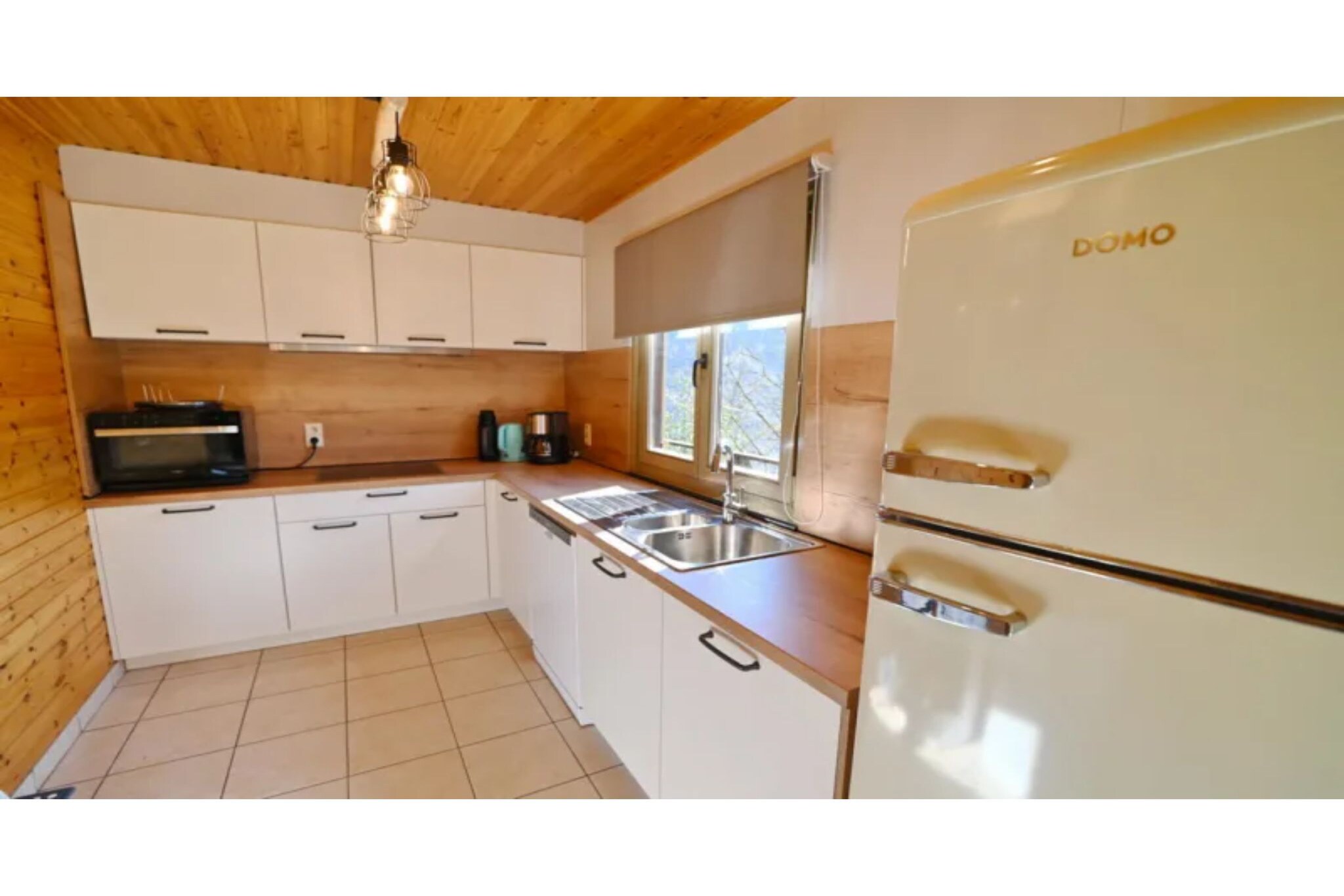 Ground floor: (bedroom(double bed), bedroom(2x single bed), bathroom(shower, washbasin), toilet, sauna)\n\nOn the 1st floor: (Living room(TV(flatscreen), dining table, seating area, DVD player), open kitchen(electric kettle, cooker(4 ring stoves, electric), coffee machine, microwave, dishwasher, fridge), bedroom(2x single bed), bedroom(bunk bed), bathroom(bath tub, washbasin), toilet)\n\ngarage, heating(electric), terrace, garden furniture, BBQ, table football