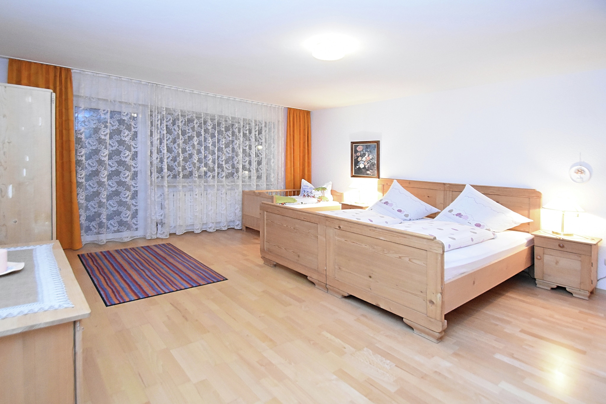 This welcoming ground-floor apartment in RÃ¶hrnbach is ideal for couples or small families. It features a spacious bedroom with a double and single bed, a cozy living room with an additional single bed, and a large kitchen equipped with ceramic cooker, oven, microwave, coffee machine, and fridge-freezer. The bathroom includes a bathtub and washing machine, while a separate toilet adds convenience. A private 10 mÂ² terrace and balcony offer peaceful outdoor spaces.

Guests enjoy central heating, a cot, garden furniture, deckchairs, parasol, and access to a shared 300 mÂ² garden with a charcoal barbecue, sandpit, and play equipment. Private parking and an ironing board are also provided. The layout is functional and family-friendly, perfect for relaxing after a day of exploring the Bavarian countryside.

Nearby, hike the scenic Buchberger Leite Gorge, cross the adventurous Wolfsteiner Ohe suspension bridge, or visit the WWII-era Felsdurchbruch rock tunnel. For dining, try Pizzeria Grotta for Italian favorites, JÃ¤gerhÃ¼tte for hearty Bavarian fare, or Restaurant Jada for regional specialties. With forest trails just 1 km away, this apartment is a perfect base for your Bavarian adventure.