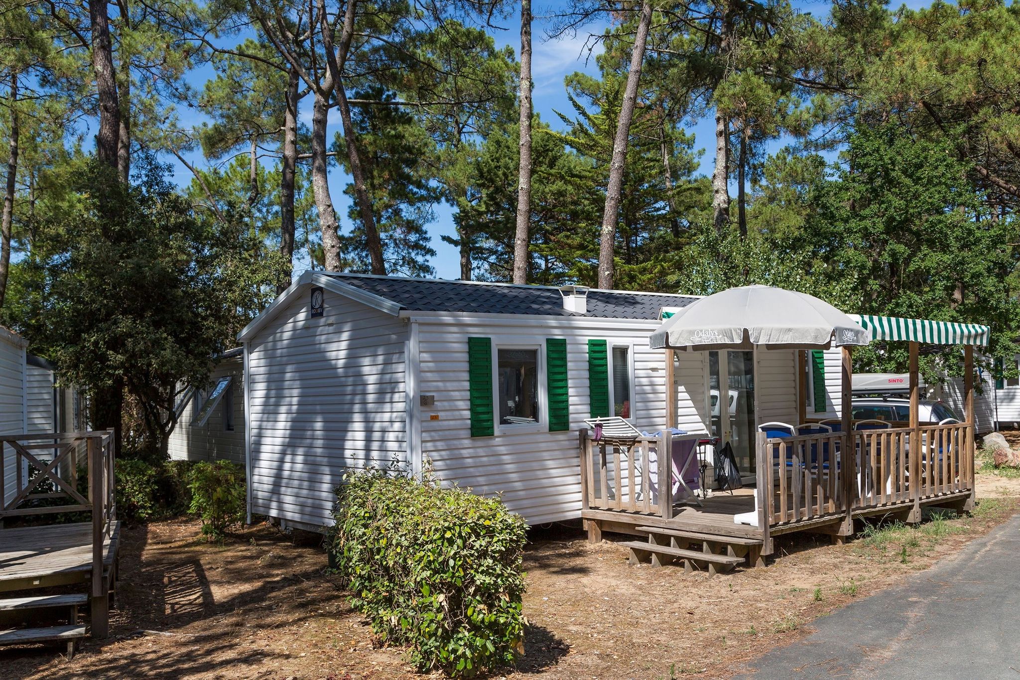 Comfortable mobile home with porch, located near the beach