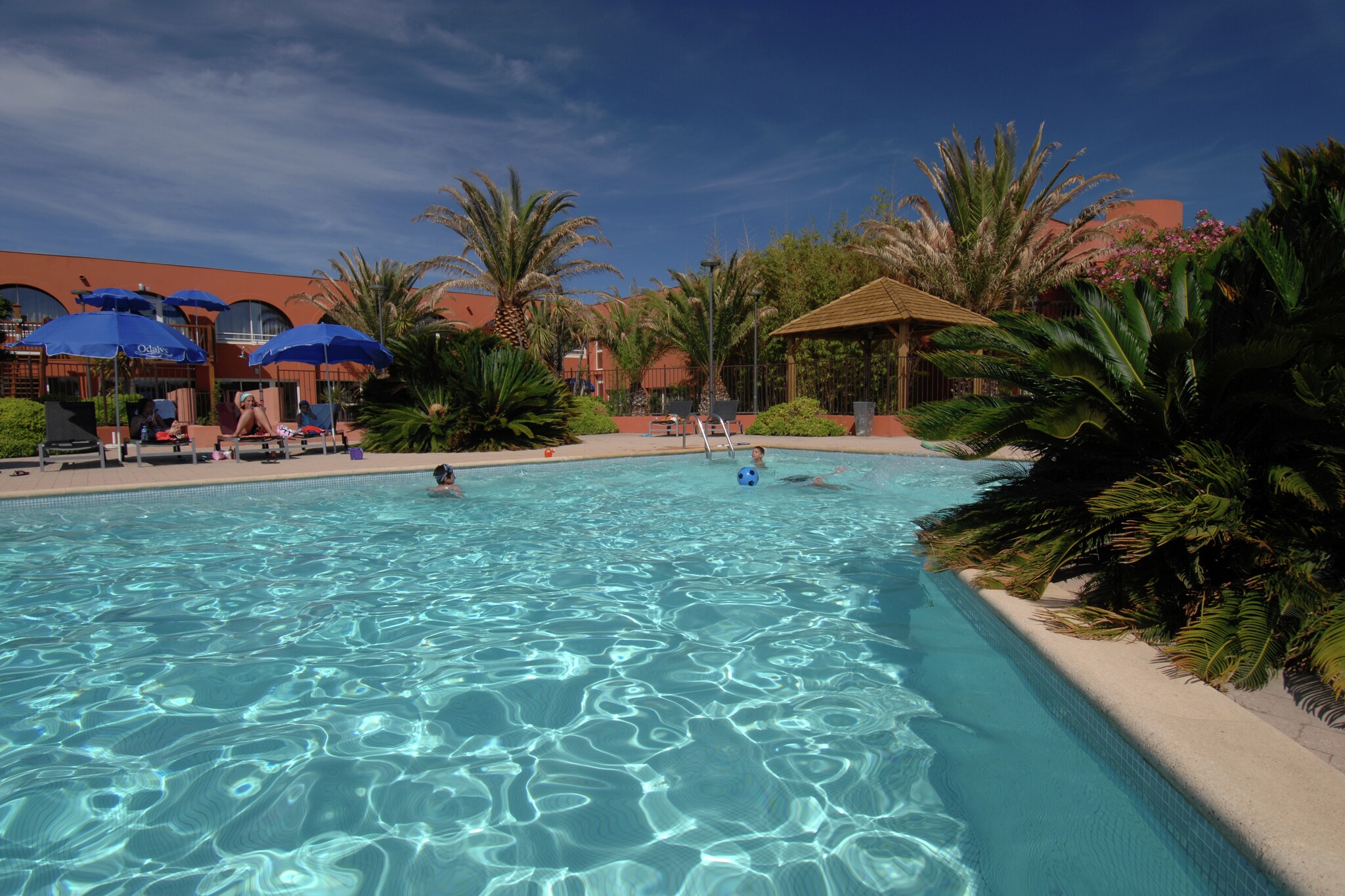 Modern Coastal Comfort in a Pet-Friendly Oasis
Welcome to your sun-drenched retreat in the heart of Cap d'Agde! Nestled in a car-free, tranquil complex, this modern apartment offers a blend of style, comfort, and peace. Whether you're staying in a cozy studio or a spacious three-room apartment, each unit boasts a sleek kitchenette, airy living space, and a private terrace or balcony perfect for morning coffee or evening wine. The well-maintained complex includes green spaces and offers direct access to shared amenities like a sparkling pool—ideal for a refreshing dip after a day of exploring.

Prime Location by the Sea & All Essentials Nearby
Located just 400 meters from shops and local conveniences, you'll have everything you need at your fingertips. Stroll down to the marina, discover sandy beaches, or enjoy a sunset walk along the coast. The lively promenade is dotted with seaside cafés, seafood restaurants, and ice cream parlors—great for both family meals and romantic evenings. You're also near Aqualand, local markets, and bicycle rentals, making it easy to enjoy both relaxation and adventure.

Bring Your Pets—Adventure Awaits for All
Pets are not only welcome—they’re celebrated! Leash up and explore Cap d'Agde’s dog-friendly beaches, or take a walk through nearby pine forests and shaded coastal trails. Some cafés even offer pup menus! With plenty of outdoor space and scenic walking paths, this is the perfect place to share your holiday with your four-legged friend.