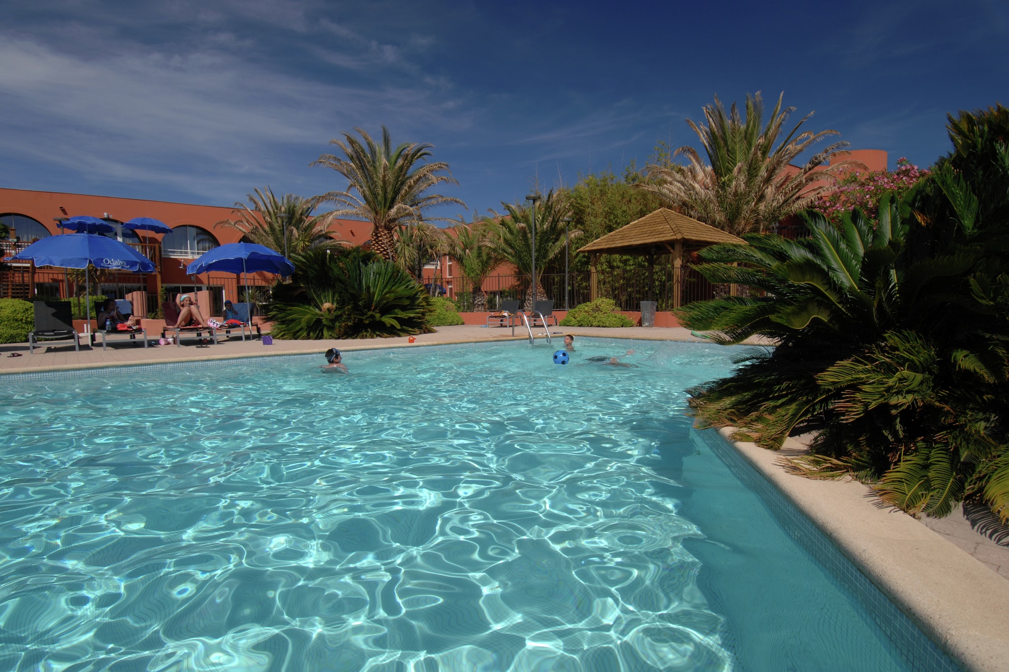 Tucked away in a tranquil, car-free complex, this modern apartment is your sunny escape in Le Cap d’Agde. The residence features stylish, well-maintained interiors and a private terrace or balcony with garden furniture—perfect for morning coffee or sunset wine. Choose from cozy studios to spacious 3-room apartments with sleeping cabins, making it ideal for couples, families, or small groups seeking both comfort and convenience by the sea.

Just 400 meters from local shops and minutes from the beach, you’ll find everything you need within easy reach. Enjoy watersports at Plage Richelieu, stroll through the charming harbor, or hop on a boat tour. Kids and adults alike will love nearby attractions like Aqualand and Luna Park. With nearby public transport and walking paths, exploring this vibrant Mediterranean town is effortless.

Bring your furry friend—pets are not just allowed, they’re welcome! Take your dog for a coastal walk on the pet-friendly portions of La Plagette or join one of the seasonal “Doggy Beach Days” nearby. Many local cafés even offer dog treats and shaded patios. For guests, savor fresh seafood, artisan gelato, and Provençal cuisine at the nearby marina. This spot blends beachside charm, family fun, and pet-friendly comfort like no other.