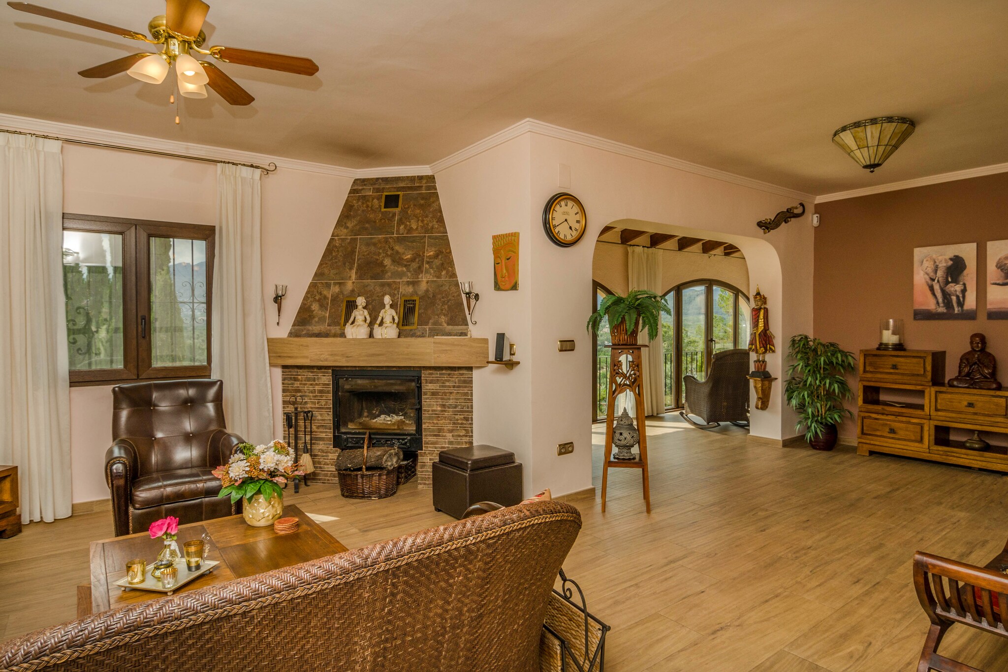 Ground floor: (Entrance, hallway, Living room(TV(satellite, dutch television channels, international television channels), dining table(8 persons), fireplace, seating area(8 persons), DVD player, stereo unit), Kitchen(cooker(ceramic), hood, coffee machine, oven, combination microwave, dishwasher, fridge, freezer), bedroom(double bed or 2 single beds, TV, balcony), bedroom(double bed or 2 single beds, TV, balcony), bedroom(double bed or 2 single beds, balcony), bedroom(double bed or 2 single beds, balcony), bathroom(bathtub with shower, shower, washbasin, toilet, bidet), bathroom(shower, washbasin, toilet), bathroom(Bubble bath, shower, washbasin, toilet, bidet), toilet)\n\ngarage, tumble dryer, Bubble bath(paid), washing machine, garden doors, balcony, heating(central, wood, oil, through air conditioning), air conditioning, terrace(private, fenced, 1000 m2), garden(private, fenced, illuminated), garden furniture, BBQ, parking, swimming pool(private, including separate children’s swimming pool (depth 50cm), 8 x 6 m.)