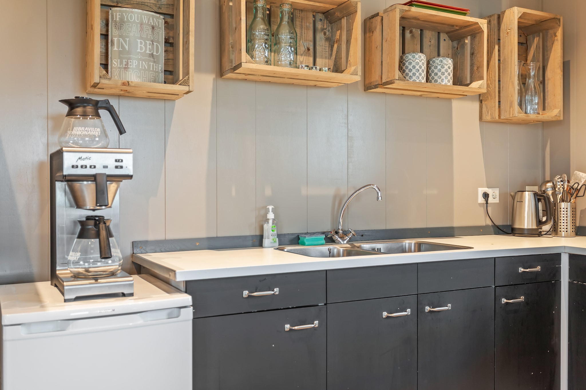 Ground floor: (Entrance, hall, open kitchen(electric kettle, cooker(4 ring stoves, gas), coffee machine(filter), oven, microwave, dishwasher, fridge, freezer), Living/diningroom(TV(digital, International television channels), dining table(24 persons), seating area, stereo unit), bathroom(3x shower, 2x washbasin, 2x toilet), bathroom(2x shower, 2x washbasin, 2x toilet), garden doors, terrace(56 m2), garden(partially fenced), garden furniture, parking, parasol)\n\nOn the 1st floor: (bedroom(2x single bed), bedroom(2x single bed), bedroom(2x single bed, 2x double loft bed, washbasin), bedroom(2x single bed, single box bed, double bed box, double loft bed, washbasin), bedroom(2x single bed, single box bed, double bed box, double loft bed, washbasin))