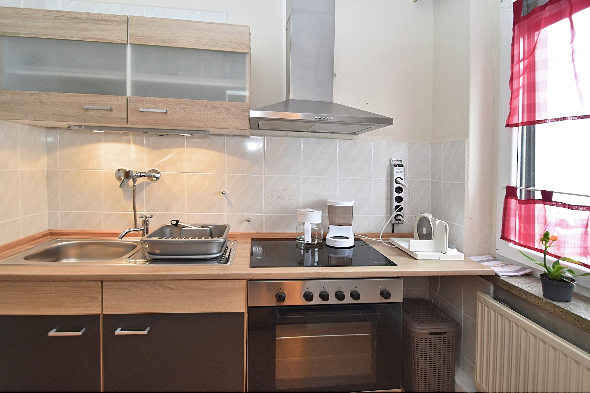 On the 1st floor: (dining room(TV(satellite), dining table, DVD player, stereo unit), open kitchen(cooker(ceramic), coffee machine, oven, microwave, fridge(+ freezer)), bedroom(double bed, double sofa bed), bedroom(single sofa bed, double bed), bathroom(shower, washbasin, toilet), Landing)\n\nwashing machine, heating, garden(shared with the owner , partially fenced), BBQ(charcoal), parking, play equipment, children\'s bed, playpen, ironing board