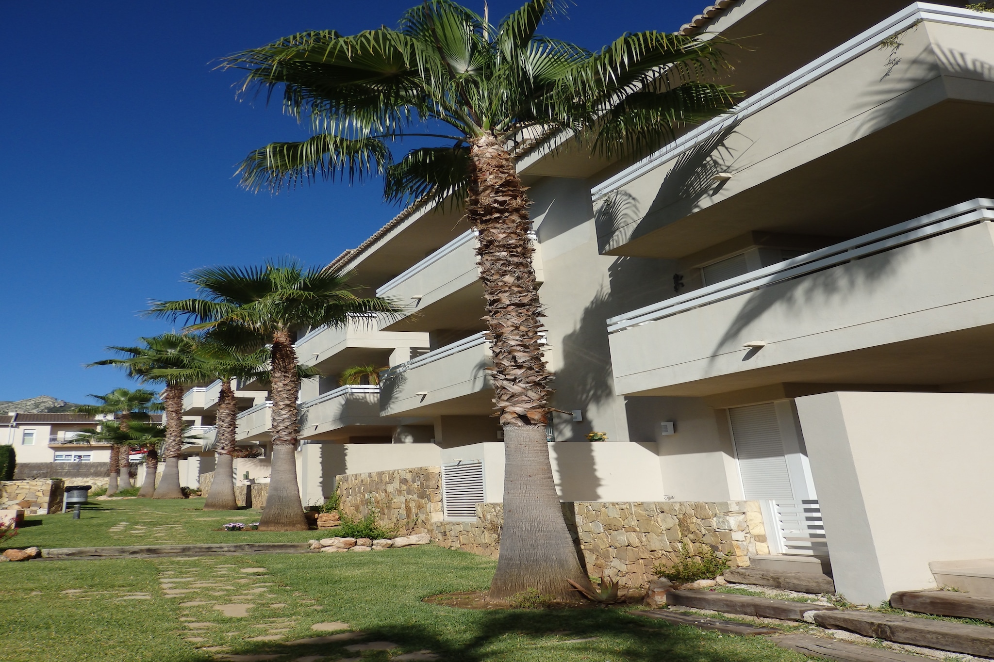 An optional utilities and service fee of EUR 170,00 will be charged before your arrival. Details are given below.<br> Charming Coastal Retreat
This inviting apartment in Pego offers a comfortable base for a family getaway. With two bedrooms accommodating up to four guests, the home blends modern comforts with a relaxed Mediterranean vibe. Unwind in the shared swimming pool or enjoy quiet mornings on the private terrace, sipping coffee while soaking in the surroundings. Air conditioning and heating ensure a pleasant stay year-round, and a cot and high chair are available for families with little ones. Explore Local Surroundings
Just 1 km from the town centre, the apartment places you near grocery stores, charming cafes, and restaurants where you can savour local cuisine. For beach lovers, the coast is just a short drive away, offering golden sands and clear waters. Nature enthusiasts can explore the nearby MontgÃ³ Nature Reserve, a serene setting for hiking, birdwatching, or simply enjoying the outdoors. Convenient Amenities Nearby
Inside, the apartment features a fully equipped kitchen, a cozy living area with satellite TV, and two comfortable bathrooms. Laundry facilities, parking, and garden access make your stay practical and convenient. Whether relaxing by the pool, preparing meals, or venturing out to local attractions, this Pego apartment offers a balanced mix of comfort and accessibility for a memorable vacation. <br><b> Optional Utilities & Service Package </b><br><b> An optional utilities and service package of EUR 170,00 </b> can be selected prior to your arrival. You will receive a separate communication with the payment link should you wish to include it.<br>This package ensures a seamless stay and conveniently covers services such as final cleaning, utility consumption, service support, and protection against minor damages or incidental costs during your stay.<br>Guests who prefer may manage these services independently, provided the property is returned in good order at check-out.