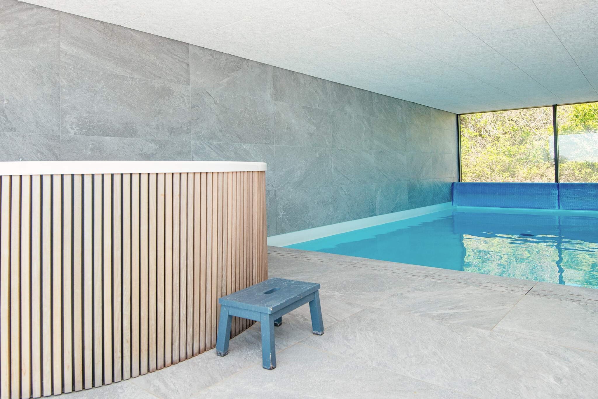 open kitchen(cooker(electric), hood, coffee machine, microwave, dishwasher, fridge, freezer(60-99L)), Living/bed room(TV(cable, danish TV channels (DR1 and TV2)), fireplace), bedroom(double bed), bedroom(double bed), bedroom(double bed), bedroom(2x single bed), bedroom(2x bunk bed), bathroom(bathtub or shower, washbasin, toilet, washing machine), bathroom(bathtub or shower, washbasin, toilet), bathroom(bathtub or shower, washbasin, toilet), game computer, Bubble bath(indoor, heated, 5 persons), sauna(indoor, heated, 5 persons), terrace, BBQ, swimming pool(indoor, 350 m2), table football, geothermal energy, air to air heatpump, air to water heatpump