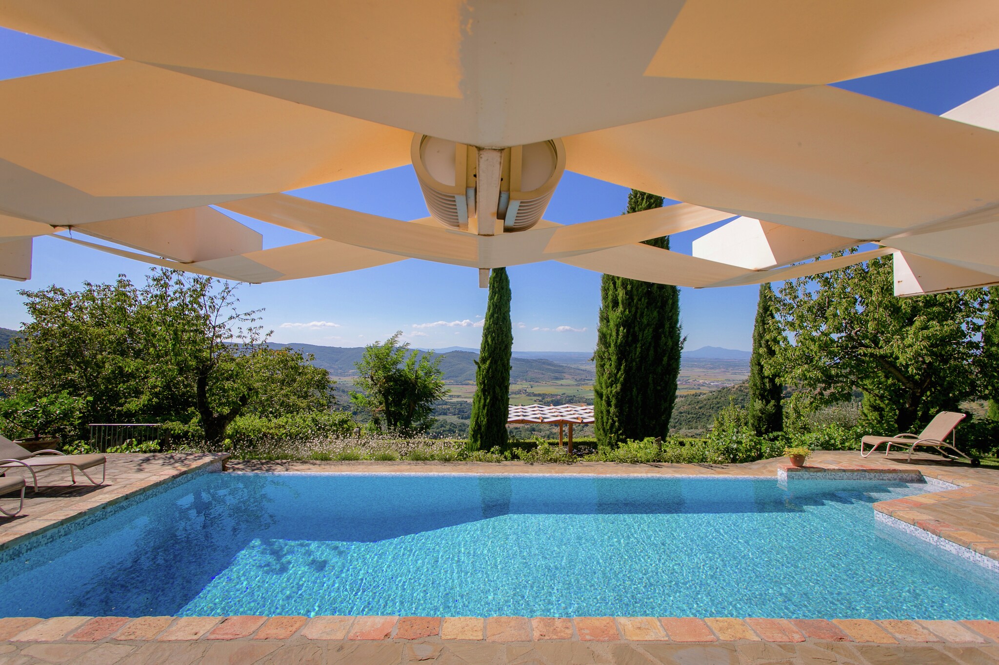 This is a traditional villa in Cortona with 4 bedrooms and can accommodate 8 people. It is surrounded by cherry trees and offers stunning views of the hills around it. It features a swimming pool and sauna for relaxation and is perfectly suited for families.



The area is great for hiking and cycling. You can even visit Lake Trasimeno from here. The town centre is just 1 km away and here you will find restaurants.



The home has a garden with furniture and a terrace with barbecue. It is child-friendly and has a childrenâ€™s bed. It offers bed linen and bath towels.



The nearest airport is Perugia San Francesco d'Assisi - Umbria International Airport, 60 km away.

