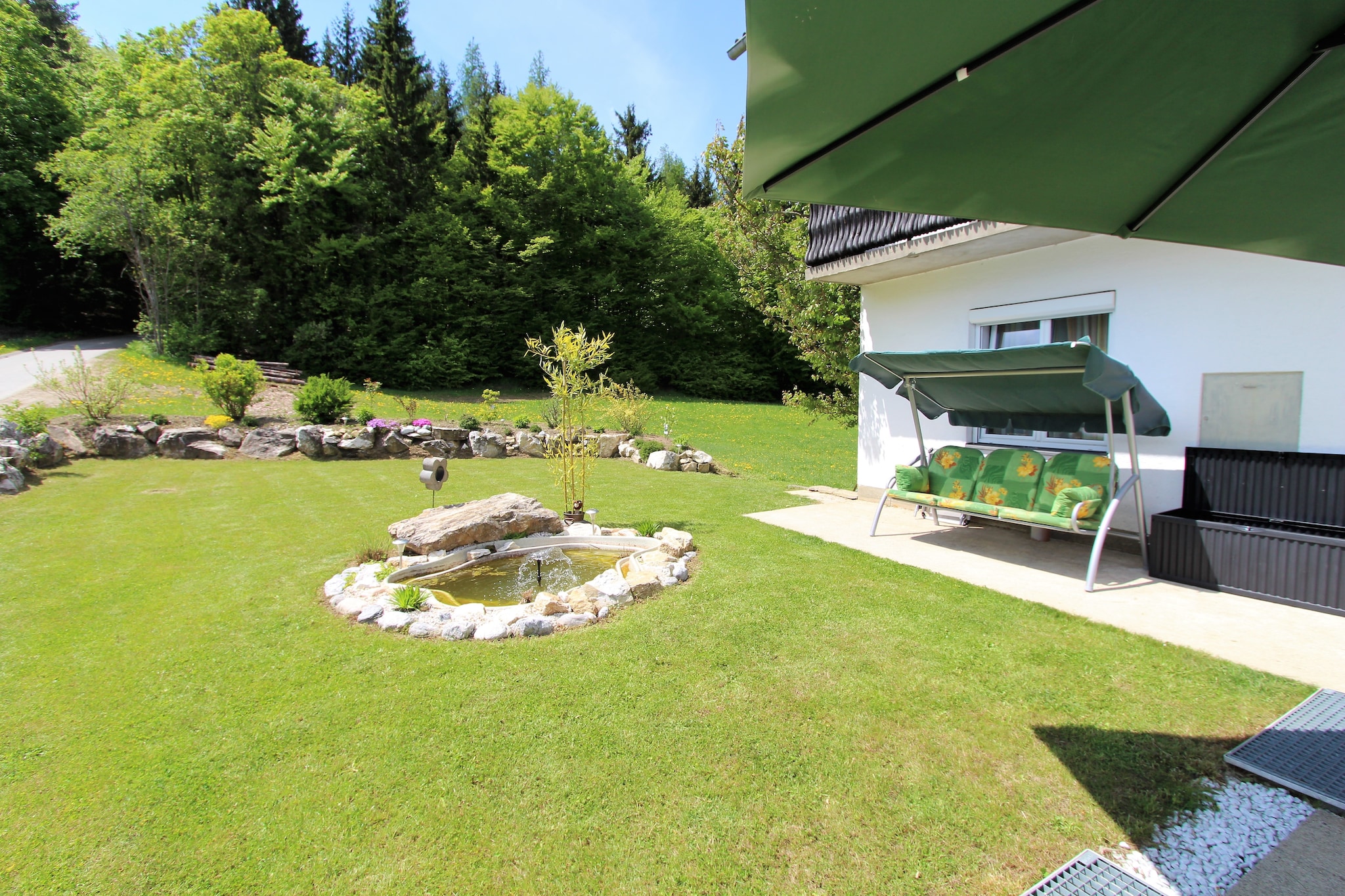 Ground floor: (Entrance)\n\nOn the 1st floor: (hallway, Living room(double sofa bed, TV(flatscreen), seating area), Kitchen(cooker(4 ring stoves, ceramic), hood, coffee machine, oven, dishwasher, fridge-freezer, balcony), bedroom(double bed, balcony), bedroom(double bed), bathroom(bathtub with shower, shower, washbasin, washing machine), toilet)\n\nbalcony, garden, garden furniture, BBQ, parking