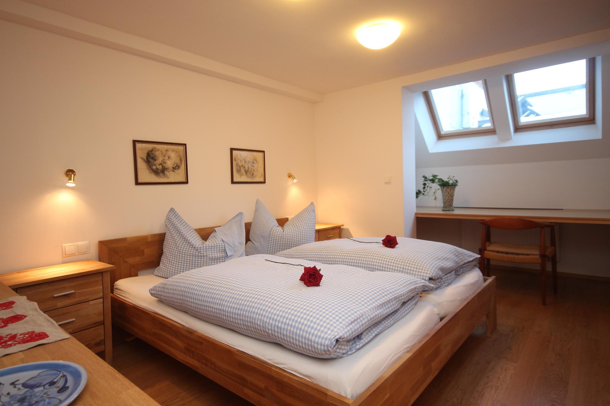 Ground floor: (open kitchen(toaster, cooker(2 ring stoves), coffee machine, microwave, fridge-freezer), Living/diningroom(TV(cable), dining table, seating area), bedroom(double bed), bedroom(bunk bed), bathroom(shower, washbasin, toilet), electric kettle)\n\nbicycle storage, parking