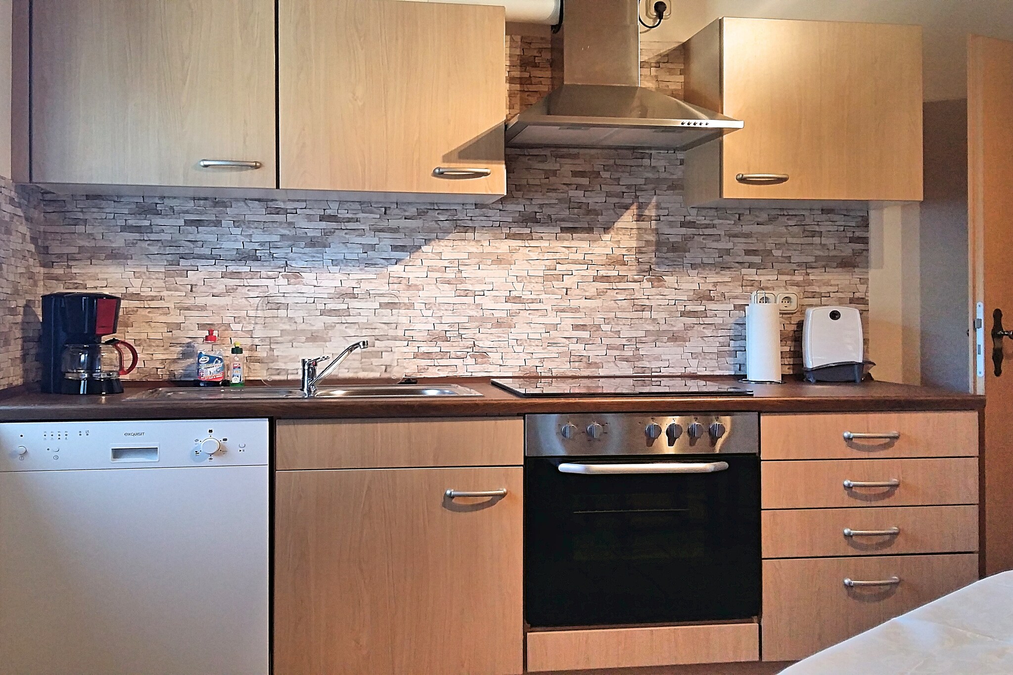 On the 1st floor: (Kitchen(dining table, electric kettle, toaster, cooker(ceramic, electric), coffee machine(filter), oven, microwave, dishwasher, fridge(+ freezer)), Living/diningroom(TV(flatscreen), stereo unit), bedroom(double bed(180 x 200 cm)), bedroom(double bed(180 x 200 cm)), bathroom(shower(walk-in shower), washbasin, toilet, hairdryer), Landing)\n\ntumble dryer(shared with the owner ), washing machine(shared with the owner ), heating(central, oil), terrace, garden(shared with the owner , partially fenced, 300 m2), bicycle storage, garden furniture, BBQ(charcoal), parking, deckchairs, parasol, darts, ironing board, iron, party games