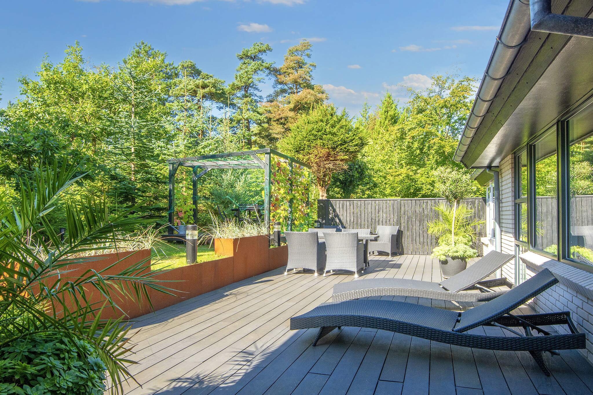 Holiday home with hot tub and unique, quiet location in a small clearing in Hemmet Strand. The beach is only a 4-minute walk from the holiday home along forest paths. The holiday home has a separate parents' section with a master bedroom with its own TV and a children's section. Good kitchen with all modern facilities. The conservatory is fully integrated into the house and has fantastic light and a 180-degree view of the garden. From the holiday home's living room, terrace and master bedroom, you can enjoy the magnificent natural surroundings in complete privacy. The many trees on the property give the house a very special atmosphere, where squirrels and hares also feel at home. The holiday home is registered with Svøm og Leg, which provides free access to nine swimming pools. Not available for hire by youth groups.A refundable deposit might be charged closer to your check-in date. The security deposit ensures a smooth stay and covers any additional services or consumption charges.This deposit covers utilities consumed during your stay and any additional services that may be taken.The final amount will be adjusted based on actual meter readings, actual usage of extra services, and any remaining balance will be refunded within 21 days after checkout.This deposit simply acts as a prepayment for charges that you would anyways pay for, ensuring a seamless stay and check-out experience.