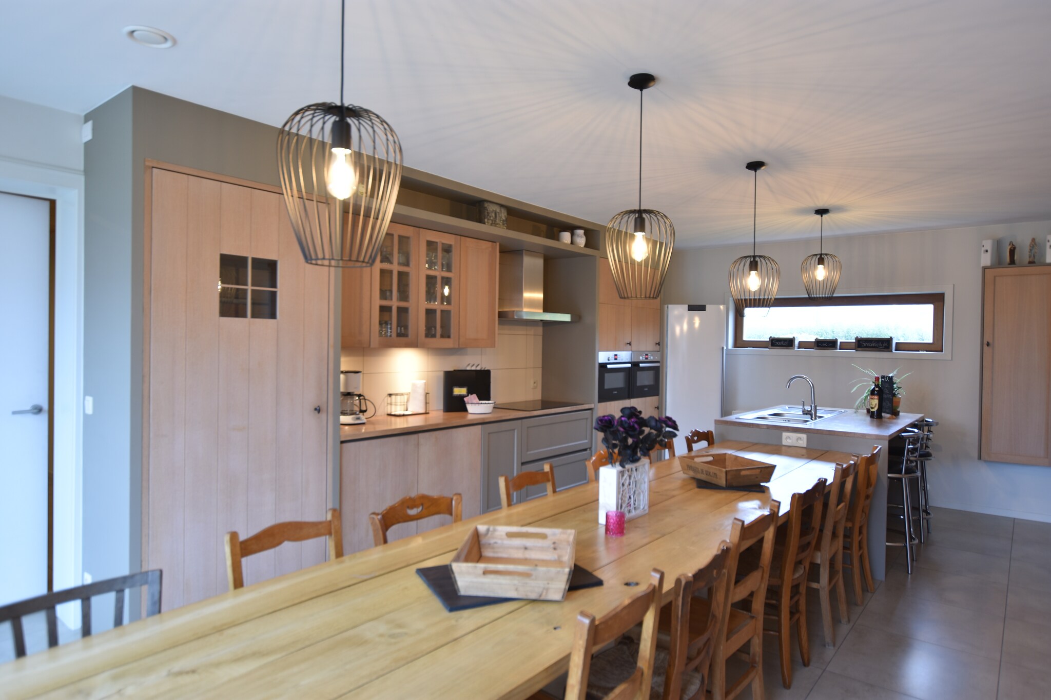 Spacious Family Retreat
This 6-bedroom holiday home in Poperinge comfortably hosts up to 14 guests, making it ideal for families or groups. Featuring a roofed terrace and a fenced garden, the home invites you to relax, unwind, and enjoy quality time together. The living room, equipped with a wood stove and digital TV, offers a cozy spot for gatherings, while the fully equipped kitchen allows you to prepare meals for everyone. Childrenâ€™s beds are available for the little guests, ensuring a comfortable stay for all ages.

Convenient Local Access
Located just 500 meters from the town centre, this property is close to restaurants, shops, and local attractions. The river is only 800 meters away, and the forest is within 4 km, perfect for hiking or a peaceful walk. The sea is just 24 km from the home, making it easy to plan a day trip to the coast. Parking is available on-site, ensuring a hassle-free stay for guests arriving by car.

Outdoor Leisure & Fun
The garden is furnished with sun loungers and a charcoal BBQ, ideal for al fresco dining and sun-soaked afternoons. A boules court and a trampoline provide fun options for children and adults alike. With a roofed terrace, you can enjoy outdoor meals or simply take in the fresh air no matter the weather. The home combines comfort, convenience, and a warm, welcoming atmosphere for a memorable stay in West Flanders.