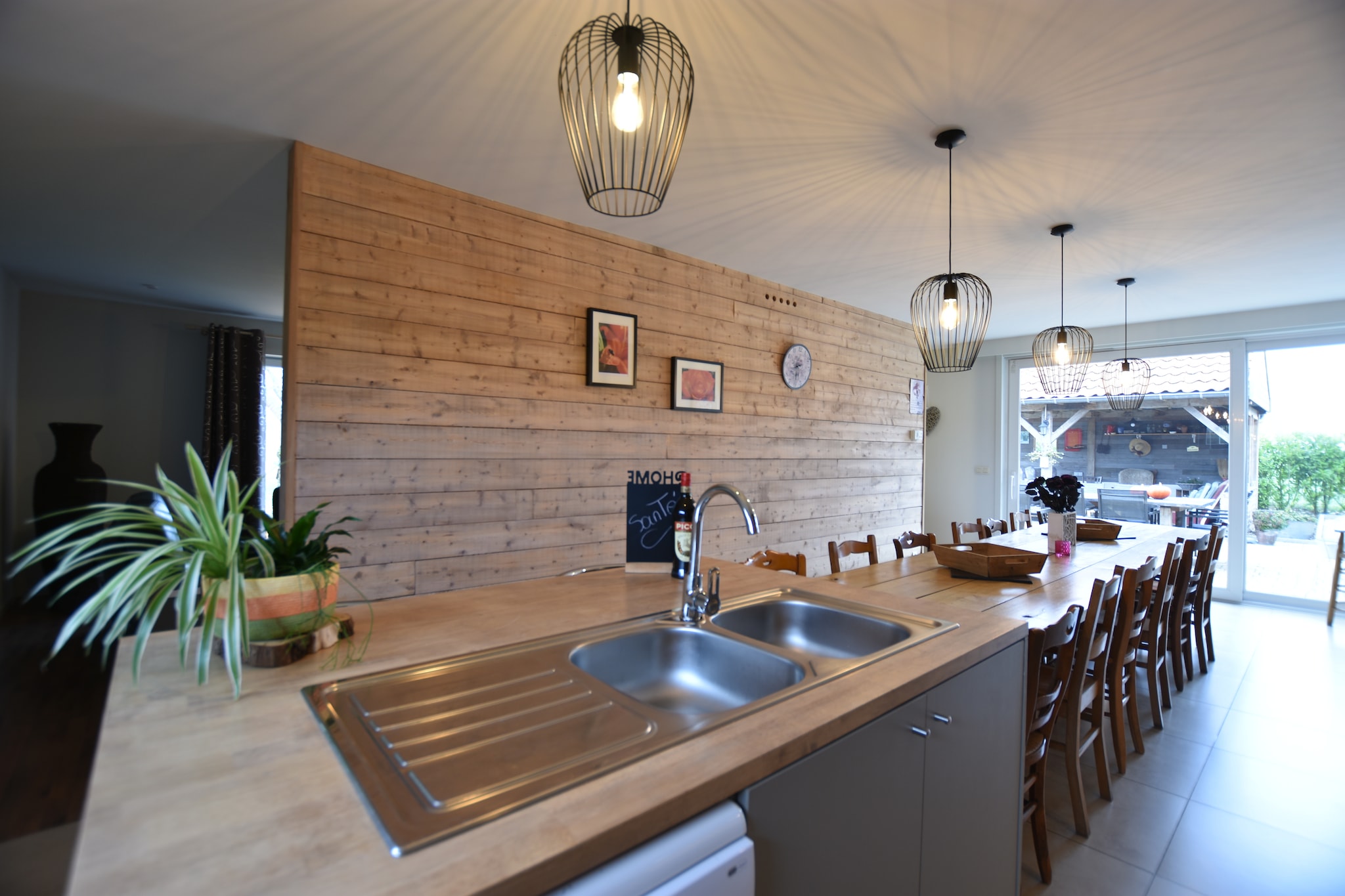 Ground floor: (hallway(toilet), Living room(TV, stove(wood)), Kitchen(cooker(5 ring stoves, ceramic), 2x combination microwave, dishwasher, fridge), Bedroom with bathroom(double bed, shower, washbasin), Bedroom with bathroom(double bed, shower, washbasin), Bedroom with bathroom(double bed, shower, washbasin), Bedroom with bathroom(bunk bed, shower(adapted for disabled), washbasin, toilet(adapted for disabled)), Landing(toilet), pantry(freezer, washing machine))\n\nOn the 1st floor: (Bedroom with bathroom(double bed, Bubble bath, washbasin, 2x children\'s bed), Bedroom with bathroom(4x single bed, shower, washbasin), Landing(toilet))\n\nfireplace, coffee machine, microwave, bathtub or shower, terrace, terrace(roofed), garden(fenced), garden furniture, sun loungers, BBQ(charcoal), parking, trampoline, boules court, ironing board