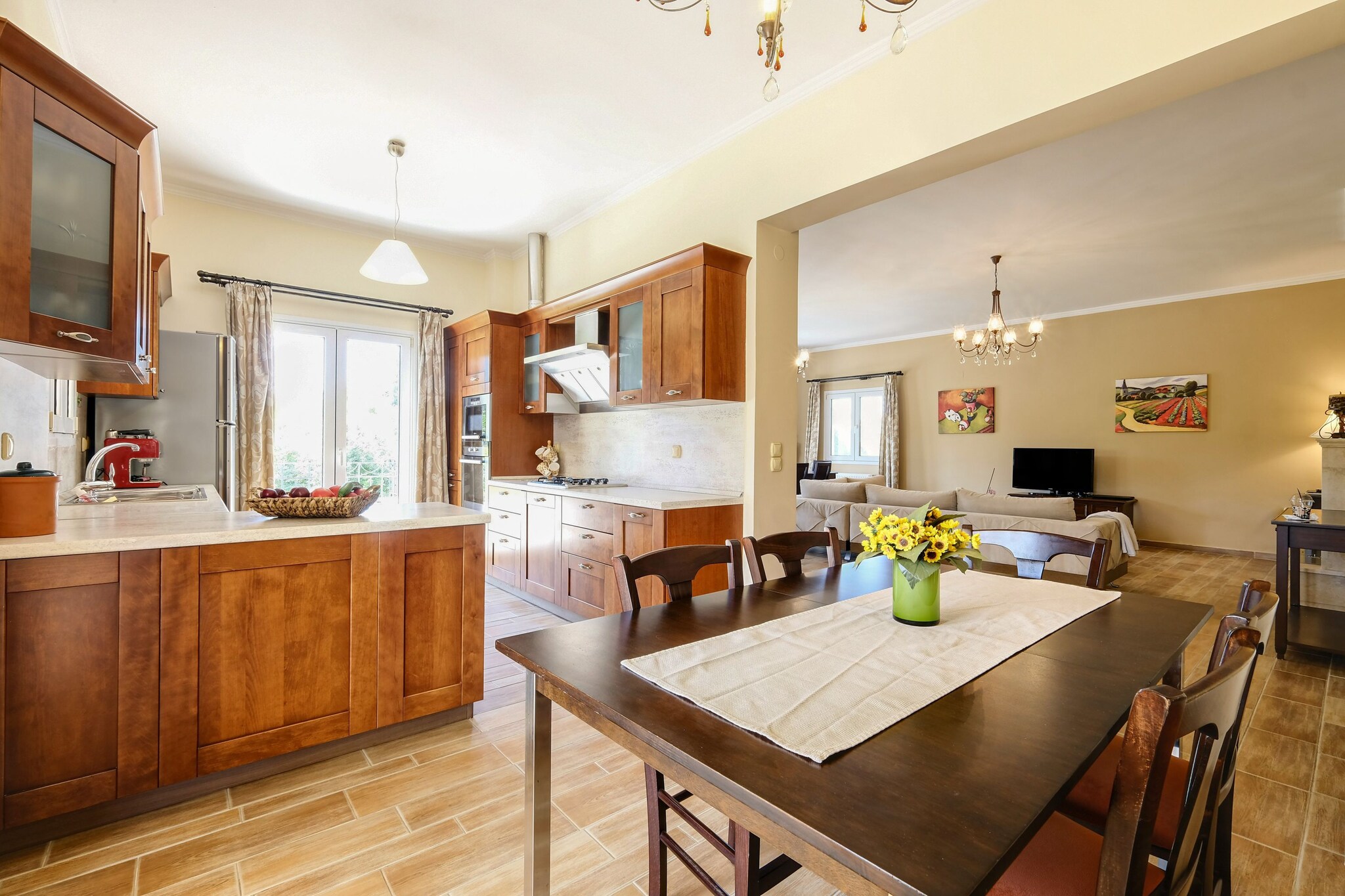 On the 1st floor: (Living room(TV, fireplace, DVD player), dining room(dining table(6 persons)), Kitchen(electric kettle, toaster, cooker(4 ring stoves, gas), 2x espresso machine, oven, microwave, dishwasher, fridge-freezer), bedroom(double bed(150 x 200 cm)), bedroom(2x single bed(90 x 200 cm)), bedroom(2x single bed(90 x 200 cm)), bathroom(Bubble bath, shower, washbasin, toilet), bathroom(bathtub with shower, washbasin, toilet))\n\nwashing machine, heating, air conditioning, terrace, garden, garden furniture, BBQ, parking, deckchairs, parasol, high chair, ironing board, iron, hairdryer