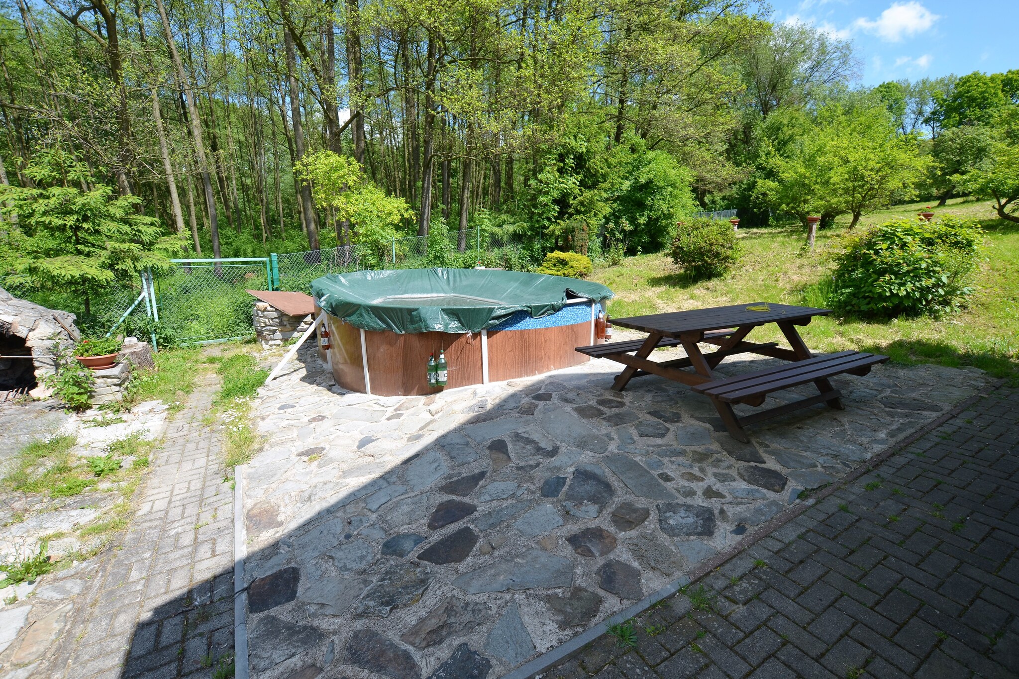 Ground floor: (Living room(TV, fireplace), dining room(dining table, stove), open kitchen(cooker(4 ring stoves, ceramic), oven, microwave, fridge), bathroom(bath tub, washbasin, toilet), sauna)\n\nOn the 1st floor: (bedroom(2x single bed, double bed), bedroom(single bed, double bed), bedroom(single bed, double bed), bedroom(2x single bed))\n\nbalcony, terrace, garden, BBQ, parking, swimming pool(private, outside,  4 x  4 m., opened from 1/2 May upto and including 1/2 Sep)