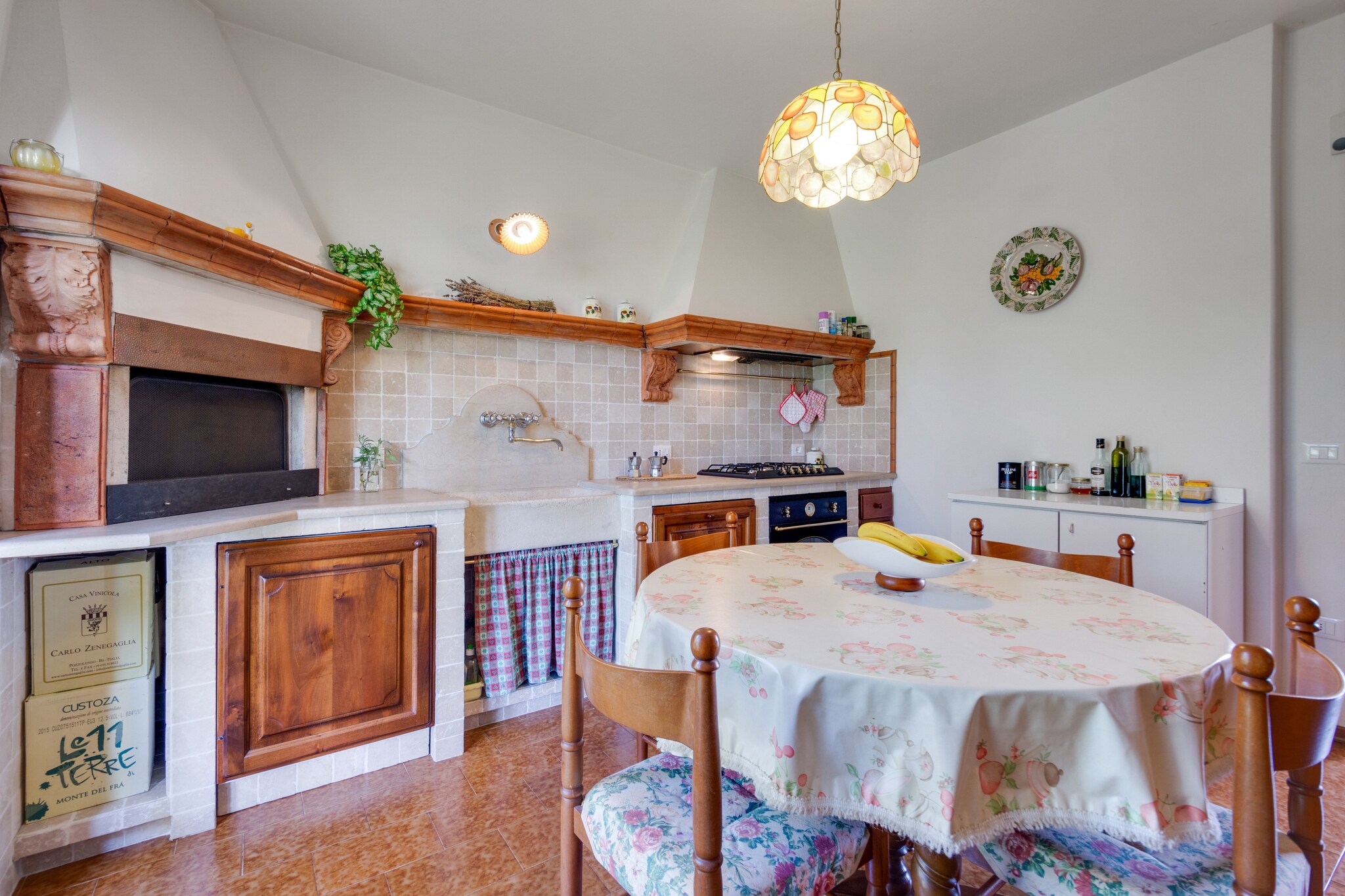 mezzanine: (Entrance, Large kitchen(TV, dining table, fireplace, boiling water tap, cooker(5 ring stoves), oven, dishwasher, fridge-freezer), Living/diningroom(TV, dining table))\n\nOn the 1st floor: (bedroom(double bed or 2 single beds), bedroom(double bed), bathroom(bathtub with shower, washbasin, toilet, bidet), bathroom(shower, washbasin, toilet))\n\ngarden(private, fenced), garden furniture, BBQ, parking, parasol