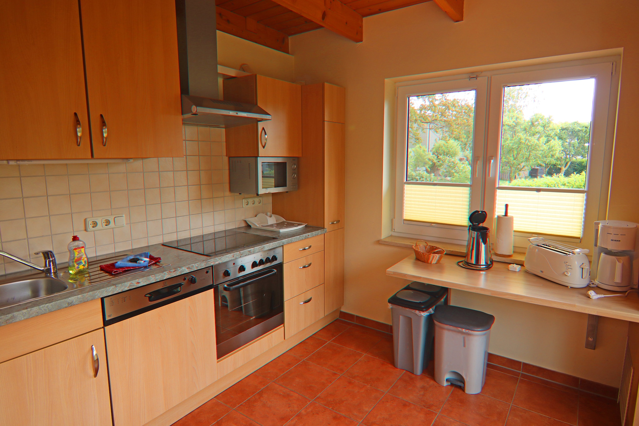 Ground floor: (open kitchen(electric kettle, toaster, cooker(4 ring stoves, ceramic), hood, coffee machine, oven, microwave, dishwasher, fridge(+ freezer)), Living/diningroom(TV(flatscreen), dining table(6 persons), fireplace, seating area), bedroom(double bed), bathroom(shower, washbasin, toilet, washing machine, hairdryer), Landing)\n\nOn the 1st floor: (bedroom(2x single bed, TV(flatscreen), seating area), bedroom(double bed, seating area), stair gate)\n\nheating, terrace(private), garden furniture, BBQ, parking, children\'s bed, high chair, insect screens