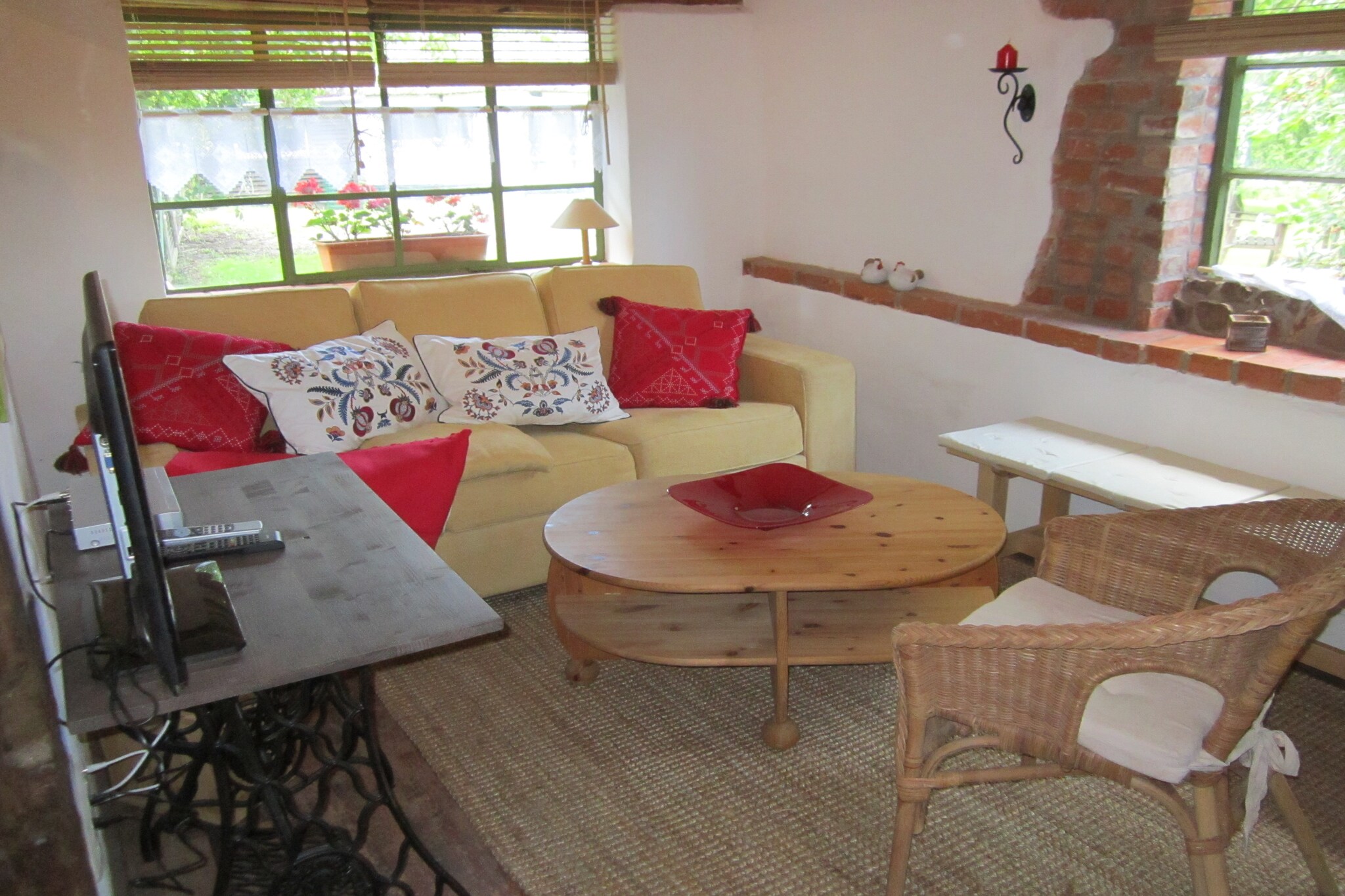 Ground floor: (Living room(TV(satellite), seating area, CD player), open kitchen(dining table, electric kettle, toaster, cooker(3 ring stoves), coffee machine, oven, microwave, fridge(+ freezer)), sleeping niche(double king size bed(180 x 200 cm)), bathroom(shower, washbasin, toilet, hairdryer), mezzanine(via fairly steep stairs)(double bed or 2 single beds), children\'s bed, high chair)\n\nterrace, garden, garden furniture, BBQ, parking, sand pit