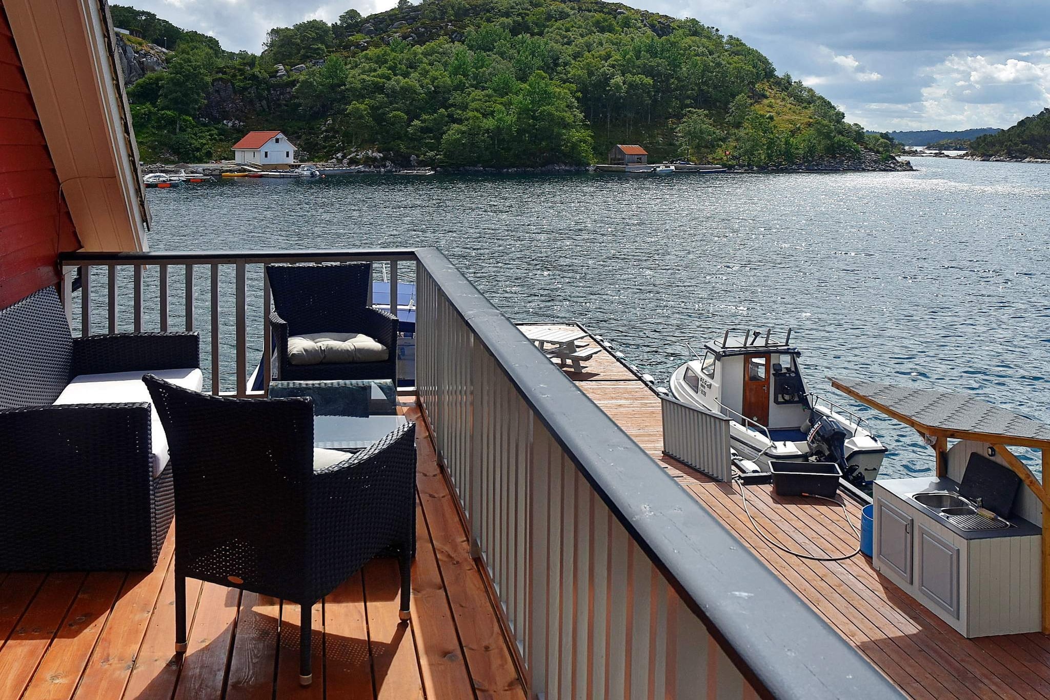 Great holiday home in maritime, fisherman’s cottage style on a southeast-facing sea plot in a sheltered cove. Short distance to great fishing spots, perfect for sport/hobby fishermen. The holiday home has a high standard with open living room with kitchen and access to a 14 sqm balcony with a beautiful view. TV/internet via fiber, 150 Mbit. Norwegian, German and international channels via Altibox. 2 bedrooms with 2 single beds, one with foldable beds. Tiled bathroom/WC with shower cubicle. Loft with 150 cm height and a camp bed. Private entrance to room for storing fishing equipment and drying fishing clothes/outdoor clothes. Conveniently located annex/grill/hot tub house, plenty of room for 4 people in the wood-fired hot tub, separate seating area. The holiday home is in a unique and beautiful hiking area with a short distance to many lakes with freshwater fishing, the nearest 400m away. From the 2026 season onwards, the house will not be a registered fishing operation (you will not be allowed to export 18 kg of fish). Covered fish filleting area with water and light. The area is rich in fish all year round, with very good fishing spots in the fjord and in open waters. A boating license is required if you were born after 1980. 2 rental boats with echo sounder/chart plotter/GPS are moored at the floating dock in front of the holiday home: 21-foot Quicksilver 640 Pilothouse with cabin/cabin and 80 HP engine, 8 rod holders 18-foot Silver Viking 18 Fisher, cabin/cabin and 50 HP engine, 4 rod holders Bed linen can be rented for NOK 175 per set, 2 towels NOK 95. Children should wear life jackets on the quay terrace on the sea side of the holiday home.