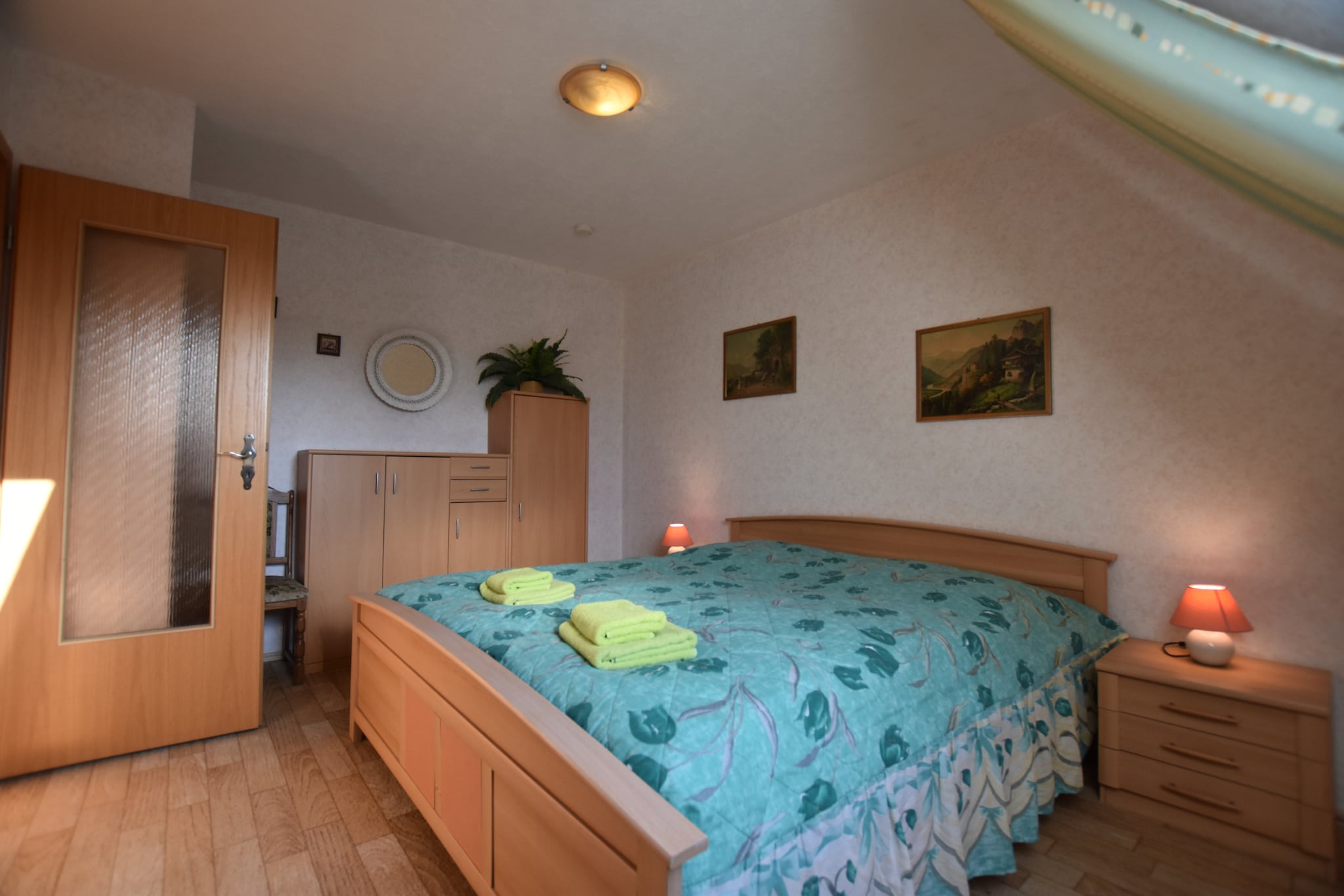 On the 1st floor: (Entrance(acces via outside stairway), open kitchen(dining table(4 persons), electric kettle, toaster, cooker(4 ring stoves, ceramic), hood, coffee machine, oven, microwave, dishwasher, fridge(+ freezer)), Living/bed room(single sofa bed, TV(satellite), seating area, radio, CD player), bedroom(double king size bed, children\'s bed), bedroom(2x single bed), bathroom(shower, washbasin, toilet, hairdryer), balcony, heating, stair gate)\n\ntumble dryer(shared with other guests, paid), washing machine(shared with other guests, paid), terrace(private, roofed), garden(fenced), bicycle storage, BBQ, parking, trampoline, deckchairs, sand pit, play equipment, slide, bicycles available(paid)